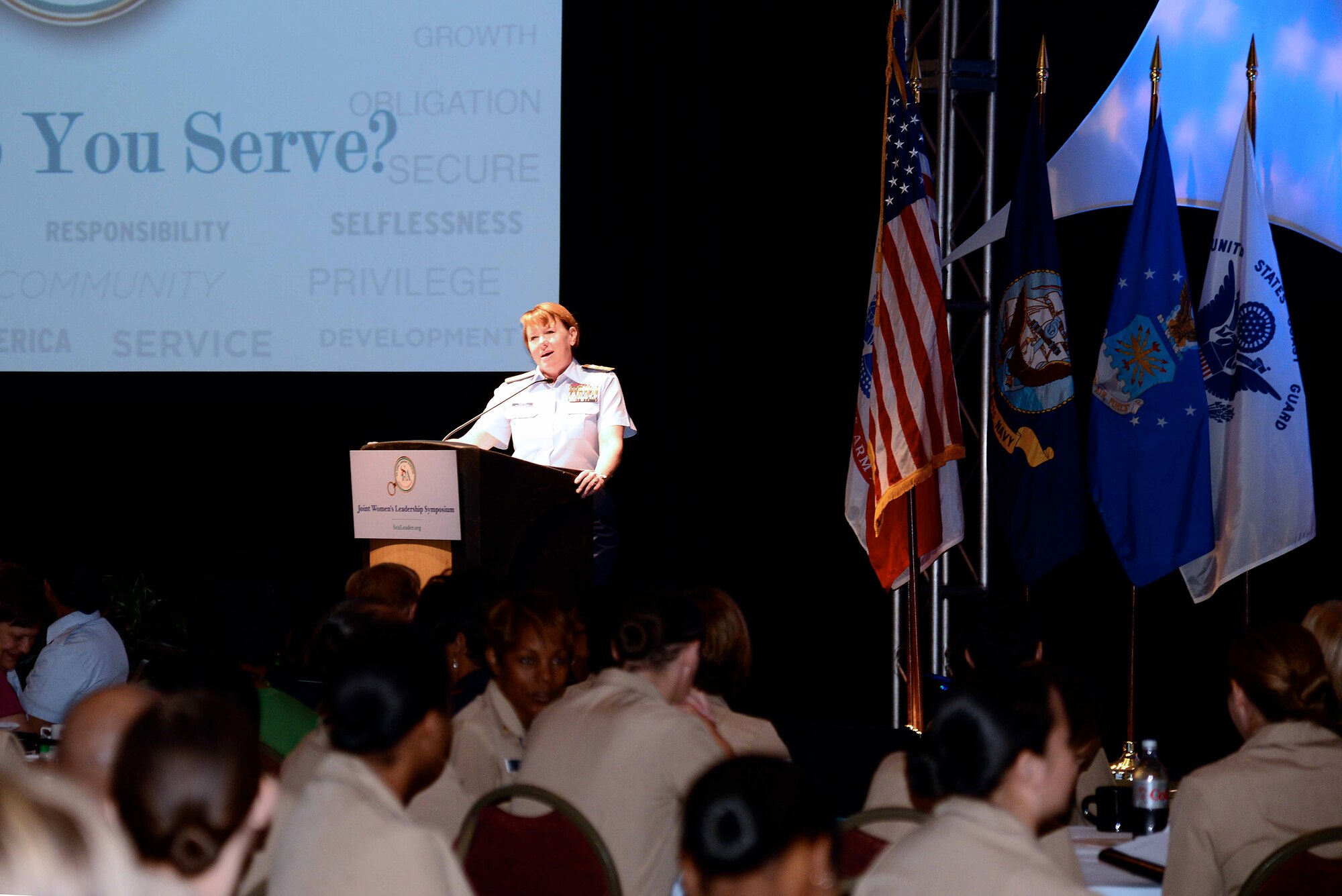 U.S. Coast Guard Rear Adm. Cari Thomas, Sea Service Leadership Association chairman of the board, delivers opening remarks at the 27th Annual Joint Women’s Leadership Symposium in Norfolk, Va., June 12, 2014.  More than 800 Service members from across the world attended the symposium, which was themed “Why Do You Serve?”  (U.S. Air Force photo by Staff Sgt. Antoinette Gibson/Released)