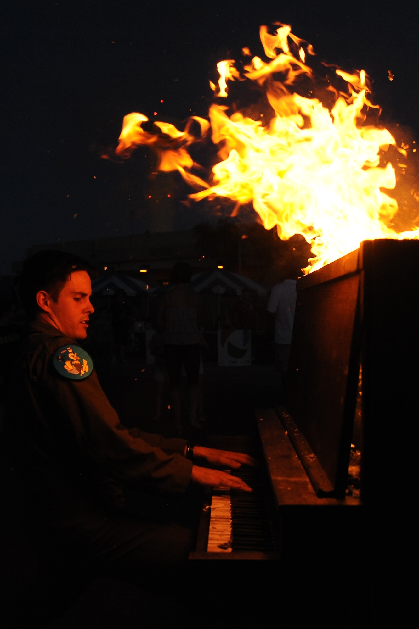 1st Lt. Tucker Browne, 309th Fighter Squadron pilot, plays Beethoven’s “Moonlight Sonata” on the burning piano. (U.S. Air Force photo/Airman 1st Class Pedro Mota)