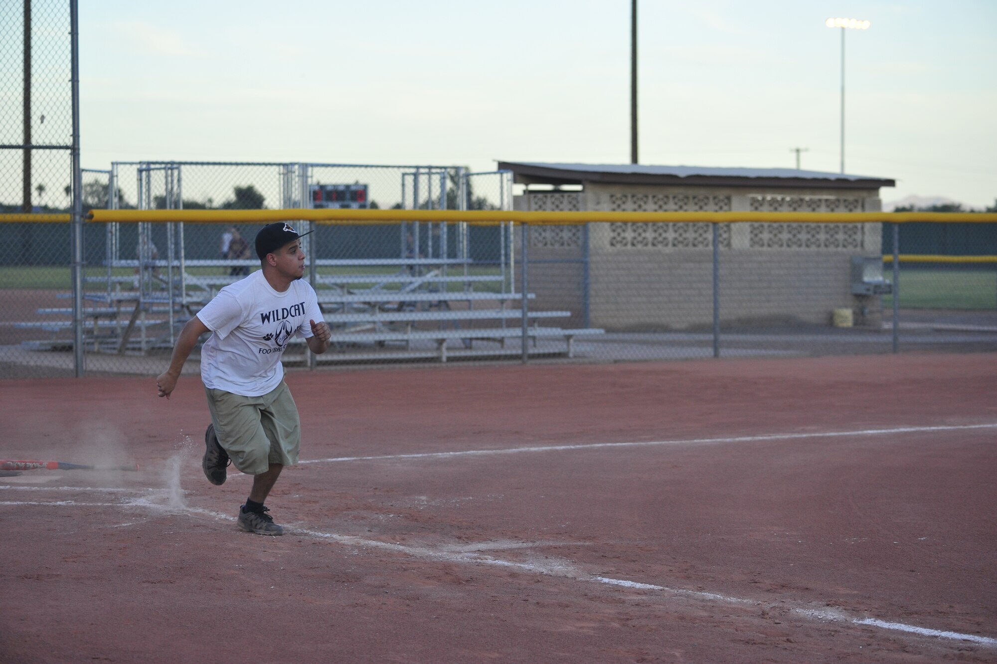 Ivan Ballinas, 56th Operations Support Squadron softball team player, sprints for first base June 3 after hitting the ball at the Luke Air Force Base Bryant Fitness Center softball field. The 56th OSS defeated the 56th Force Support Squadron 25-19 in an intramural softball game. (U.S. Air Force photo/Senior Airman Grace Lee)