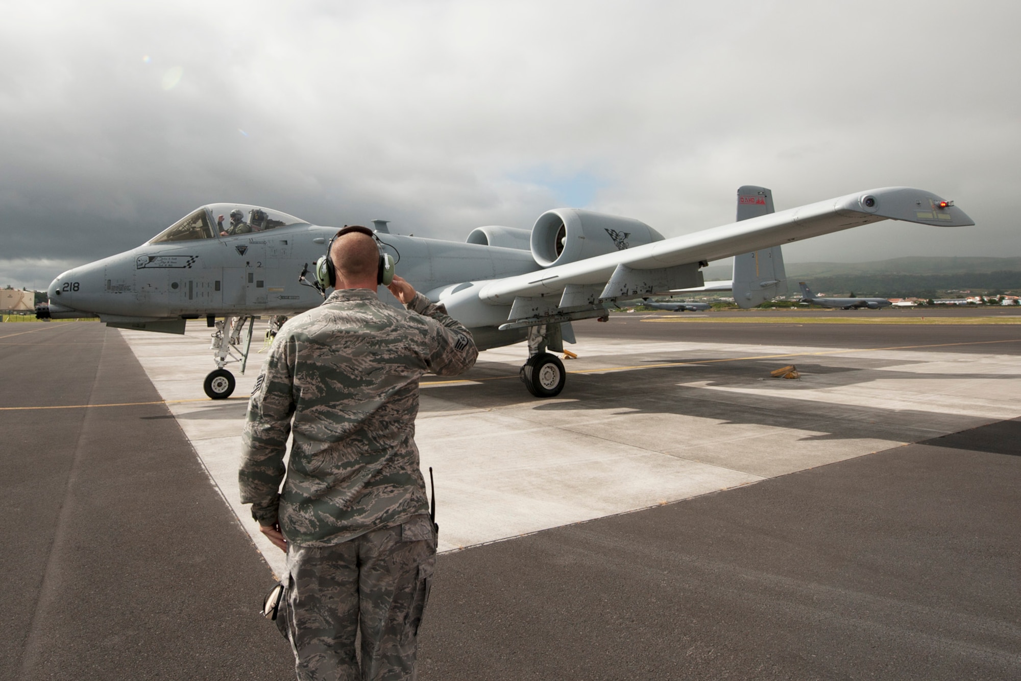 U.S. Air Force Staff Sgt. Tanner Schuman, 65th Operations Support Squadron aerospace ground equipment technician, salutes Capt. Ryan Brown, 190th Fighter Squadron A-10 Thunderbolt pilot, as he departs June 10, 2014, Lajes Field, Azores, Portugal. Schuman was trained on the procedures to preflight and launch A-10s. The 190th FS is from the Idaho Air National Guard. (U.S. Air Force photo by Tech. Sgt. Paul Villanueva II/Released)