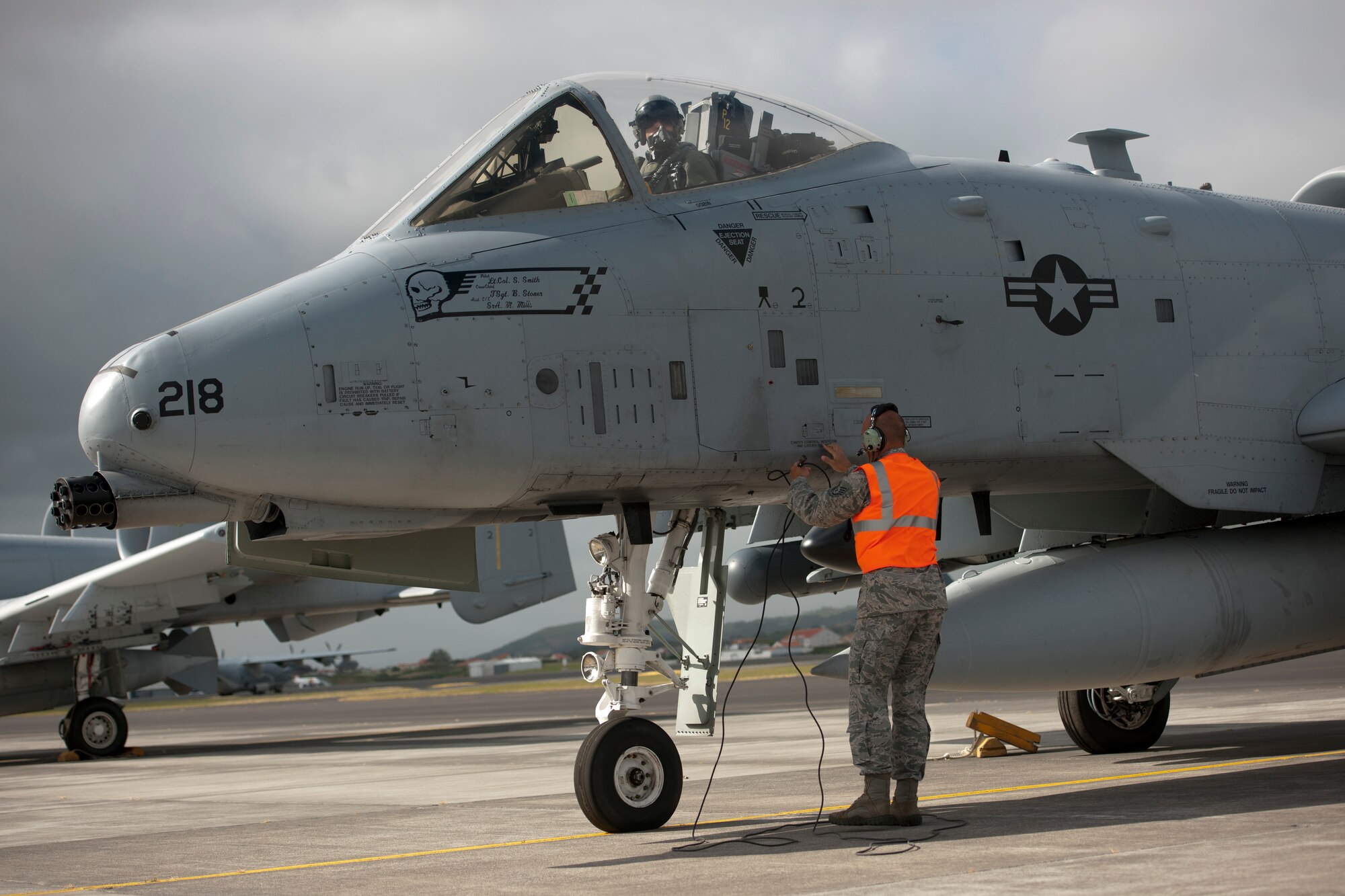 U.S. Air Force Staff Sgt. Robert McDonough, 65th Operations Support Squadron A-10 Thunderbolt crew chief, disconnects his headset radio from an A-10 prior to launching it June 10, 2014, Lajes Field, Azores, Portugal. The A-10 is specifically designed for close air support, and is capable of large and varied ordnance load, long loiter time, accurate weapons delivery, austere field capability and survivability. (U.S. Air Force photo by Tech. Sgt. Paul Villanueva II/Released)