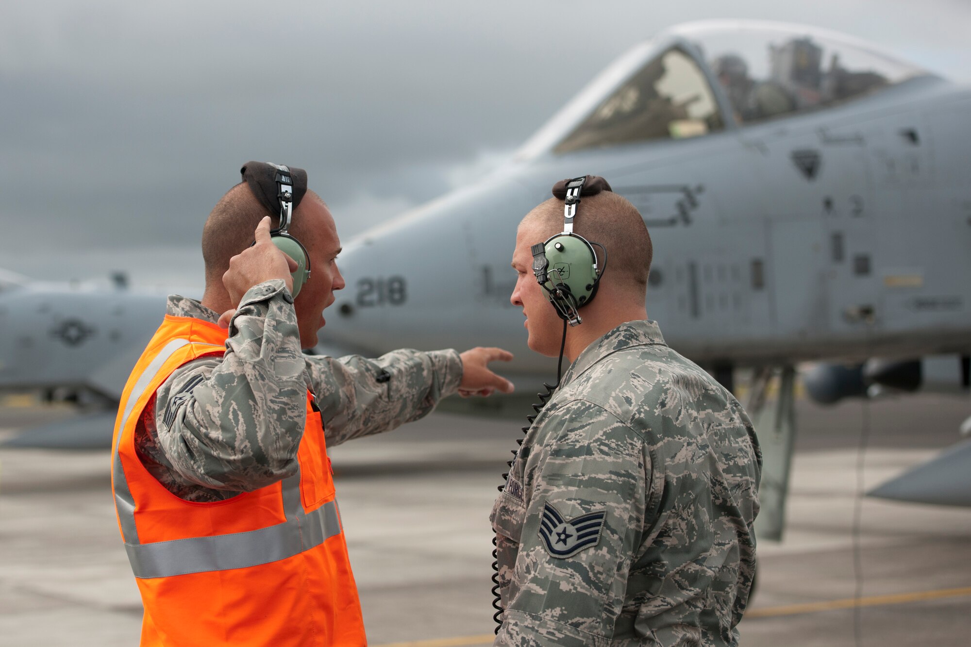 U.S. Air Force Staff Sgt. Robert McDonough, left, 65th Operations Support Squadron A-10 Thunderbolt crew chief, trains Staff Sgt. Tanner Schuman, 65th OSS aerospace ground equipment technician, on the hand signals to launch an A-10 Thunderbolt June 10, 2014, Lajes Field, Azores, Portugal. The A-10 is specifically designed for close air support, and is capable of large and varied ordnance load, long loiter time, accurate weapons delivery, austere field capability and survivability. (U.S. Air Force photo by Tech. Sgt. Paul Villanueva II/Released)