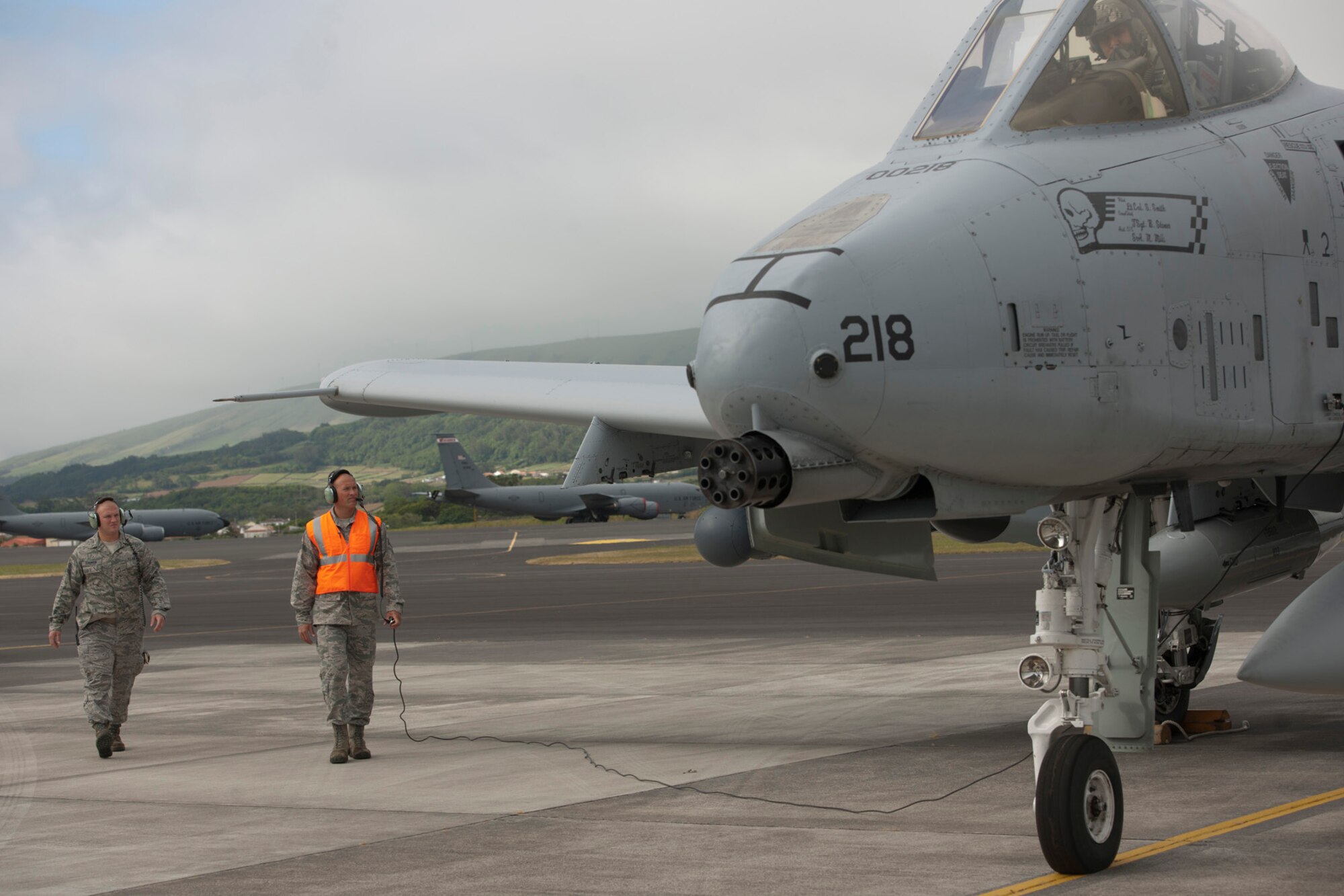 U.S. Air Force Staff Sgt. Tanner Schuman, left, 65th Operations Support Squadron aerospace ground equipment technician, and Staff Sgt. Robert McDonough, 65th OSS A-10 Thunderbolt crew chief, perform visual checks of an A-10 Thunderbolt June 10, 2014, Lajes Field, Azores, Portugal.  McDonough is training Schuman on the procedures to preflight and launch A-10s. The A-10 is specifically designed for close air support, and is capable of large and varied ordnance load, long loiter time, accurate weapons delivery, austere field capability and survivability. (U.S. Air Force photo by Tech. Sgt. Paul Villanueva II/Released)
