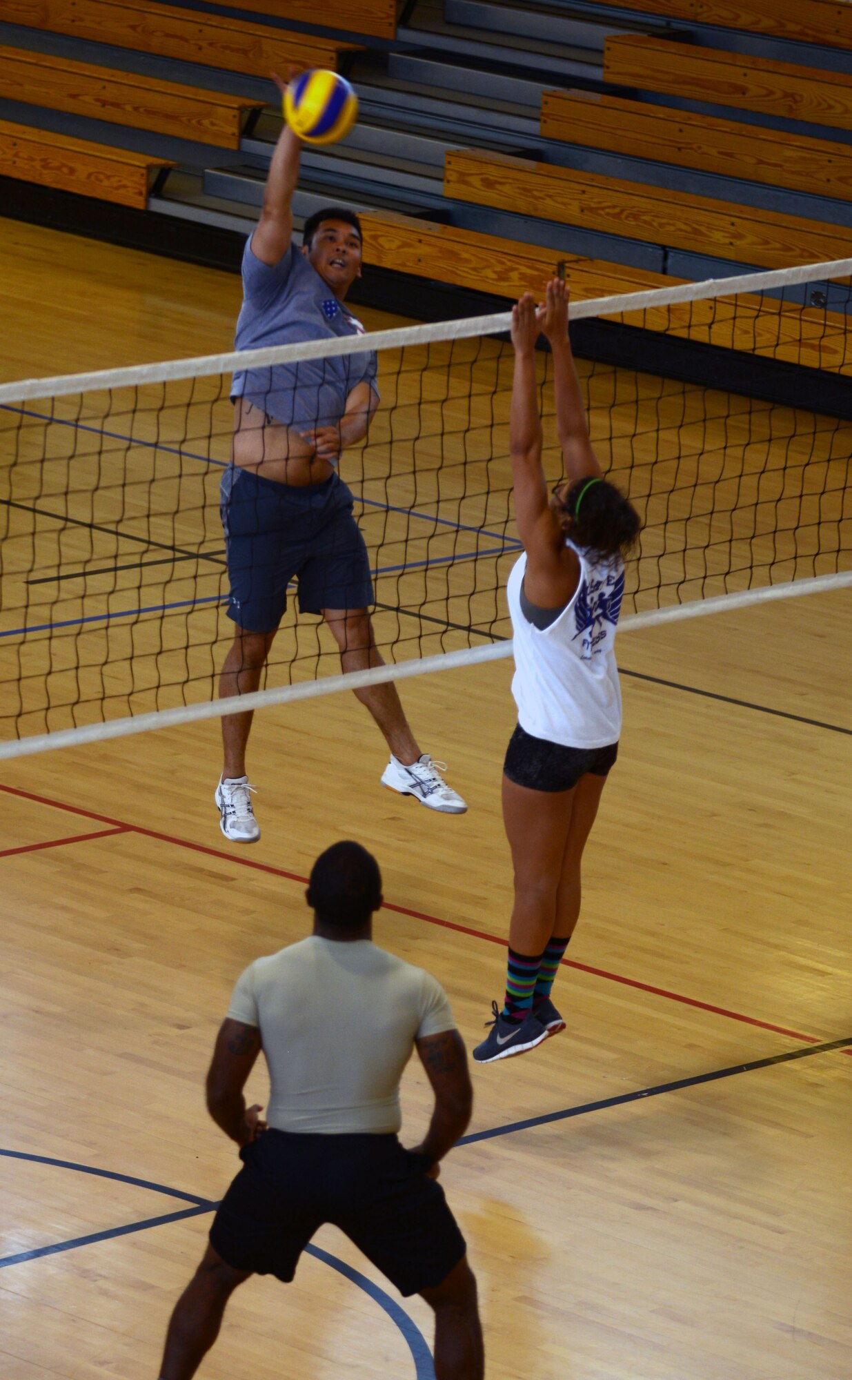 Team Mildenhall members play volleyball June 13, 2014 at the Hardstand Fitness Center on RAF Mildenhall, England. Several units on base competed in various events throughout the day as part of an annual base-wide competition, the Marauder Melee. (U.S. Air Force photo/Airman 1st Class Preston Webb/Released)