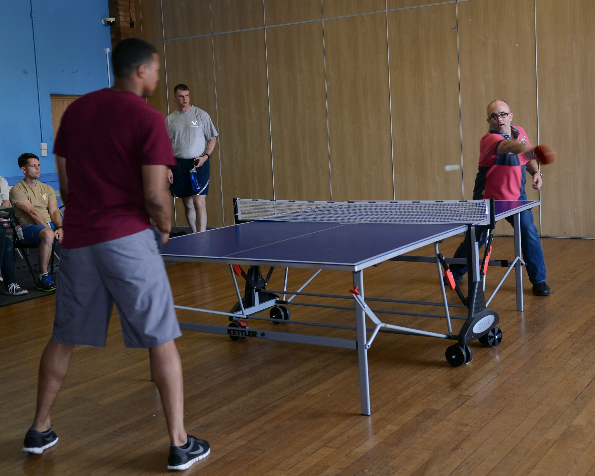 Mike Lioce, right, 100th Logistics Readiness Squadron Commander’s Support Staff representative, and U.S. Air Force Staff Sgt. Jordan McCarther, 100th LRS vehicle mechanic from Rapid City, S.D., play ping pong during the Marauder Melee June 13, 2014, at the Bob Hope Community Center on RAF Mildenhall, England. The Marauder Melee is an annual competition featuring several events which promotes fitness, friendly competition and camaraderie among various units on base. (U.S. Air Force photo/Airman 1st Class Preston Webb/Released)