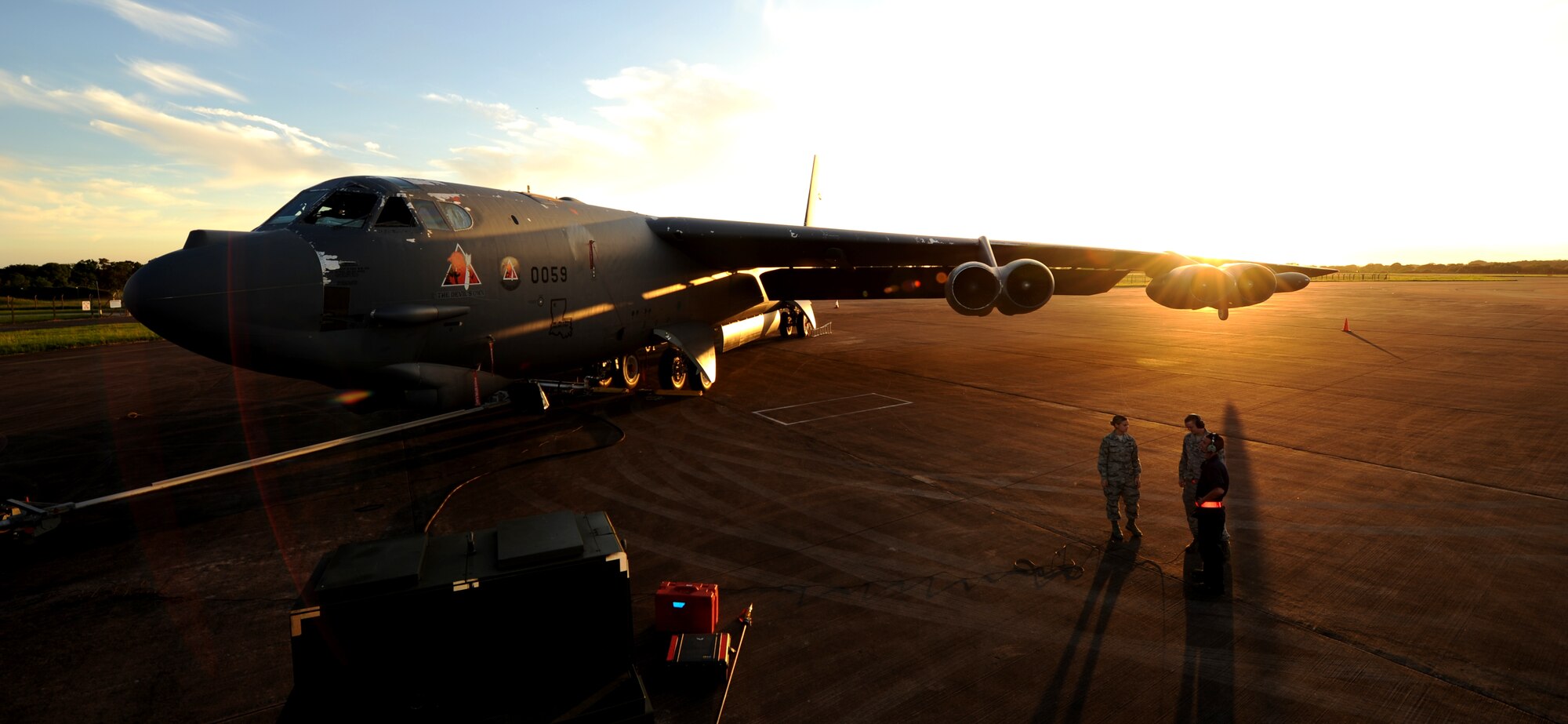 Senior Airman Rachel Rodgers, 2nd Logistics Readiness Squadron, Barksdale Air Force Base, La., fuels distribution operator, speaks with Airman 1st Class Justis Strahan, and Senior Airman Ryan Frantaccia, 2nd Aircraft Maintenance Squadron crew chiefs, discuss maintenance and refueling procedures for a B-52 Stratofortress at RAF Base Fairford, England, June 11, 2014. Airmen from Barksdale deployed to the U.S. European Command area of operations to train and integrate with U.S. and allied military forces in the region. (U.S. Air Force photo by Staff Sgt. Nick Wilson/Released)