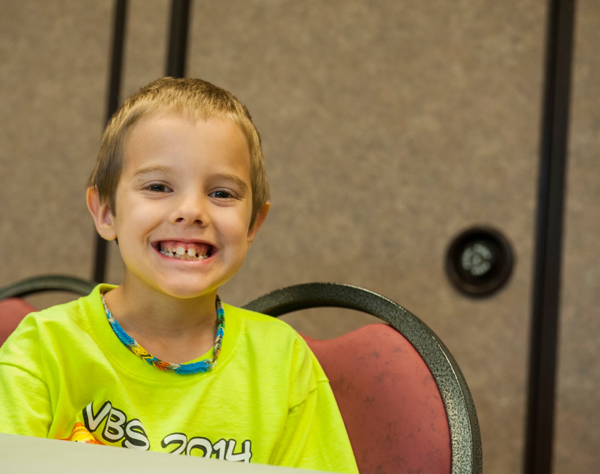 James Bingham, son of U.S. Air Force Staff Sgt. Rebecca Bingham, smiles for a photo at Vacation Bible School (VBS) at Moody Air Force Base, Ga., June 11, 2014. VBS is a weeklong event sponsored by the chapel for almost all ages to be a part of games, food and fun. (U.S. Air Force photo by Airman 1st Class Ceaira Tinsley/Released)
