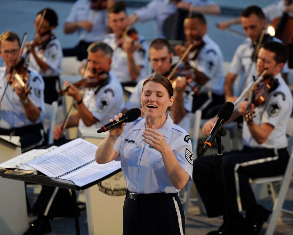 Tech. Sgt. Paige C. Martin performs on the west steps of the U.S. Capitol Building, Washington, D.C., June 10, 2014. Martin, a vocalist with The United States Air Force Band Airman of Note, performed in the D-Day 70th Anniversary Big Band Salute, which included classic World War II compositions by Maj. Glenn Miller. (U.S. Air Force photo/Senior Airman Nesha Humes)