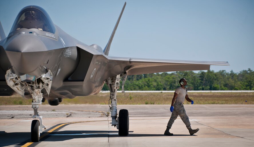 Staff Sgt. Mark Freeman, 33rd Aircraft Maintenance Squadron, performs a post-flight check on an F-35A Lightning II before refueling it at Eglin Air Force Base, Fla.  All of the F-35 variants use the refueling areas in conjunction with the 96th Logistics Readiness Squadron’s fuels flight.  (U.S. Air Force photo/Samuel King Jr.)