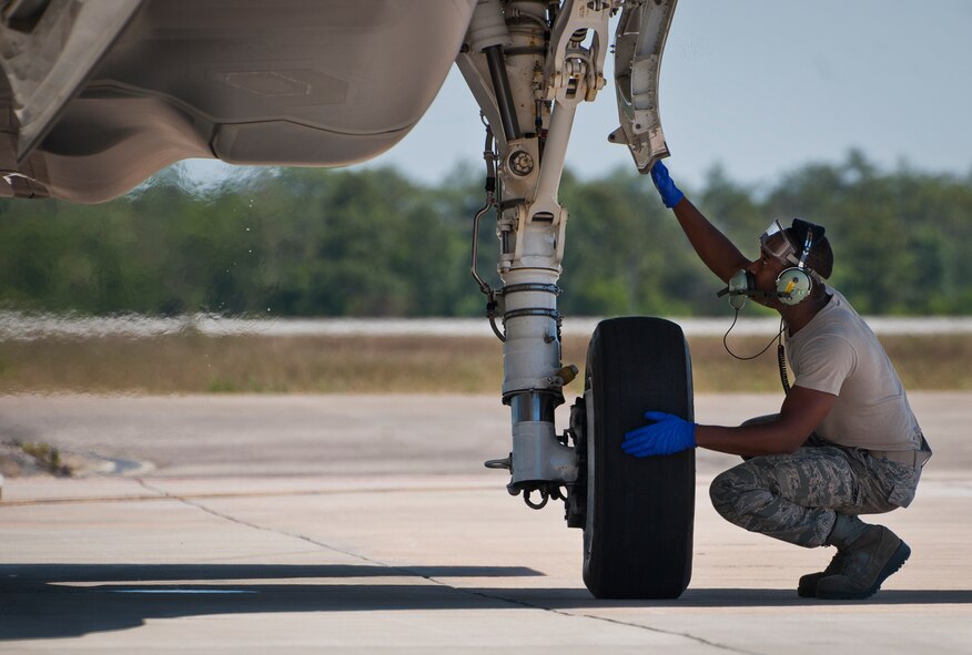 Staff Sgt. Mark Freeman, 33rd Aircraft Maintenance Squadron, performs a post-flight check on an F-35A Lightning II tire before refueling it at Eglin Air Force Base, Fla.  All of the F-35 variants use the refueling areas in conjunction with the 96th Logistics Readiness Squadron’s fuels flight.  (U.S. Air Force photo/Samuel King Jr.)