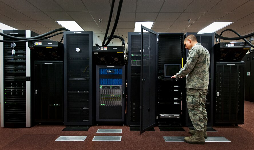 Airman 1st Class Nick Fazio, with the Network Operations, verifies the status and configuration of the 96th Communications Squadron’s data center equipment at Eglin Air Force Base, Fla., June 9.  Approximately 40 Airmen and civilians are responsible for the connectivity of the base’s more than 19,500 user workcenters on base.  Their contributions combined with the other branches and flights led to the 96th CS earning the 2013 Maj. Gen. Harold McClelland best large communications work center award for Air Force Materiel Command.  (U.S. Air Force photo/Samuel King Jr.)