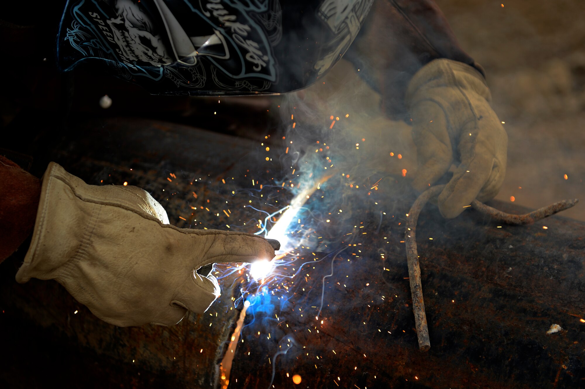 U.S. Air Force Staff Sgt. William Thomas, 577th Expeditionary Prime Base Engineer Emergency Force Squadron troop construction bravo, welds a drainage pipe together at Bagram Air Field, Afghanistan, May 17, 2014. The drainage pipe will assist in keeping the helicopter landing zone free of water. Thomas, a Cincinnati, Ohio native is deployed from the 786th Civil Engineer Squadron Ramstein Air Base, Germany. (U.S. Air Force photo by Senior Airman Sandra Welch) 