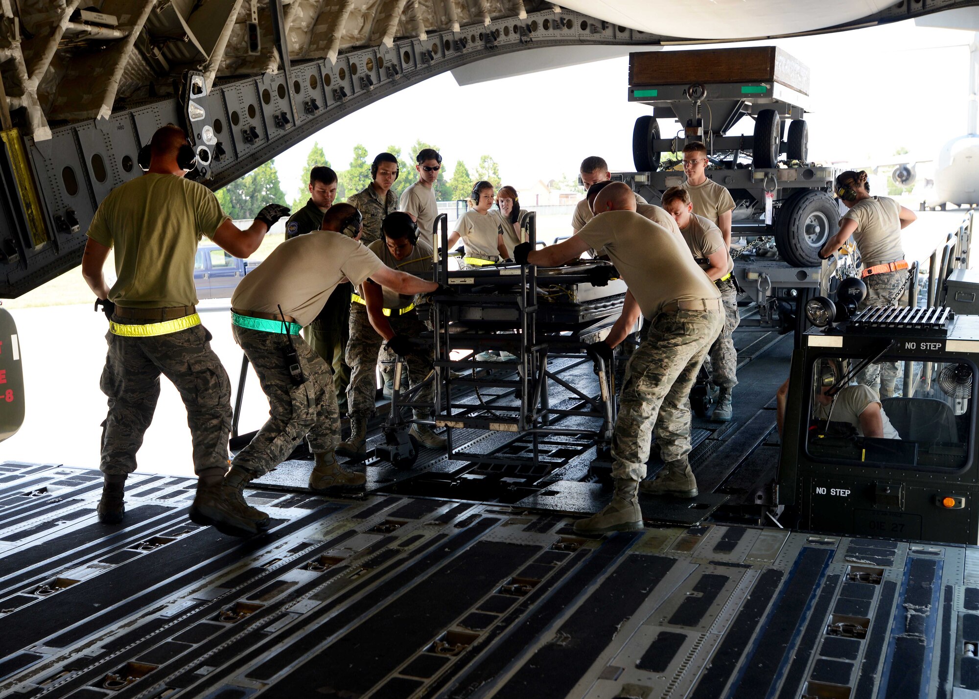Airmen from the 31st Fighter Wing load supplies on a C-17 Globemaster III before its departure from Aviano Air Base, Italy, in support of exercise Red Flag, June, 10, 2014. The exercise is aimed at maximizing combat readiness, capability and survivability.  (U.S Air Force photo/Airman 1st Class Deana Heitzman)