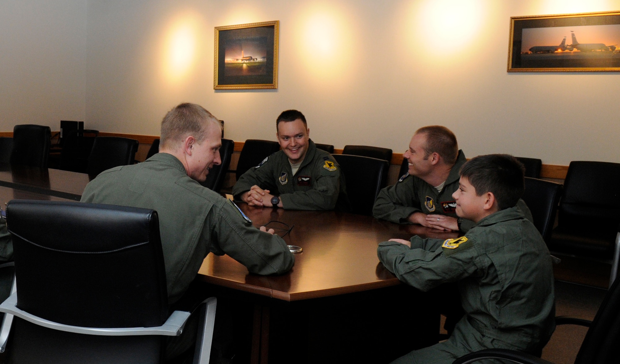 Members from the 909th Air Refueling Squadron, brief Peter Denham "Pilot for a Day" before heading out to their aircraft on Kadena Air Base, Japan, June 12, 2014. Peter's day consisted of a getting his own flight suit, piloting a KC-135 in a flight simulator, seeing and learning about the KC-135, and hanging out with actual pilots. (U.S. Air Force photo Airman 1st Class Keith James)