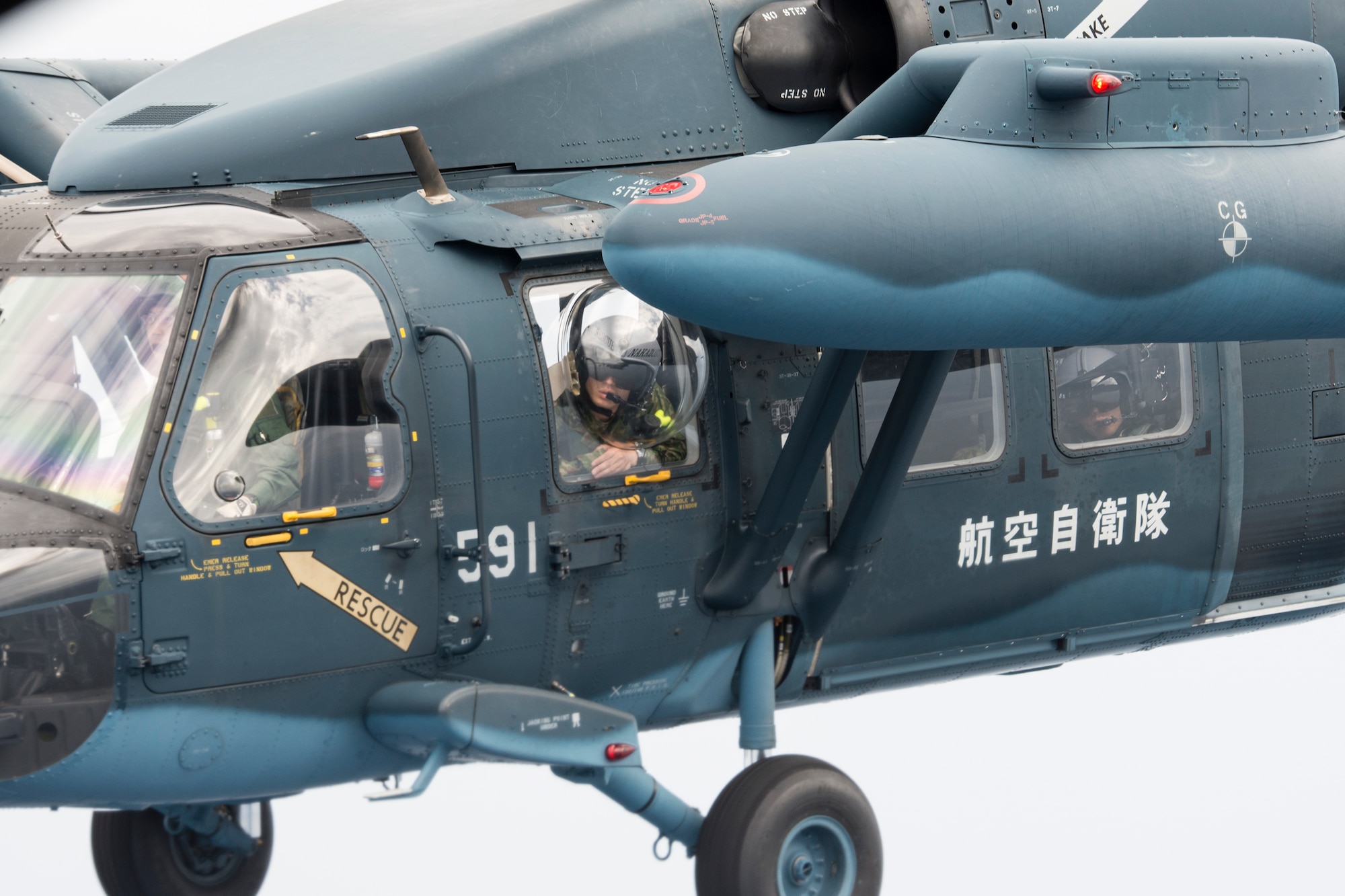 Japan Air Self-Defense Force UH-60J Black Hawk helicopter from the Komatsu Air Base prepares a Helicopter Air-to-Air Refueling June 5, 2014 above the Sea of Japan during HAAR training. This is the first time that members of the 353rd SOG held HAAR training with JASDF members in Honshu Island in Japan. (U.S. Air Force photo by Osakabe Yasuo/Released) 