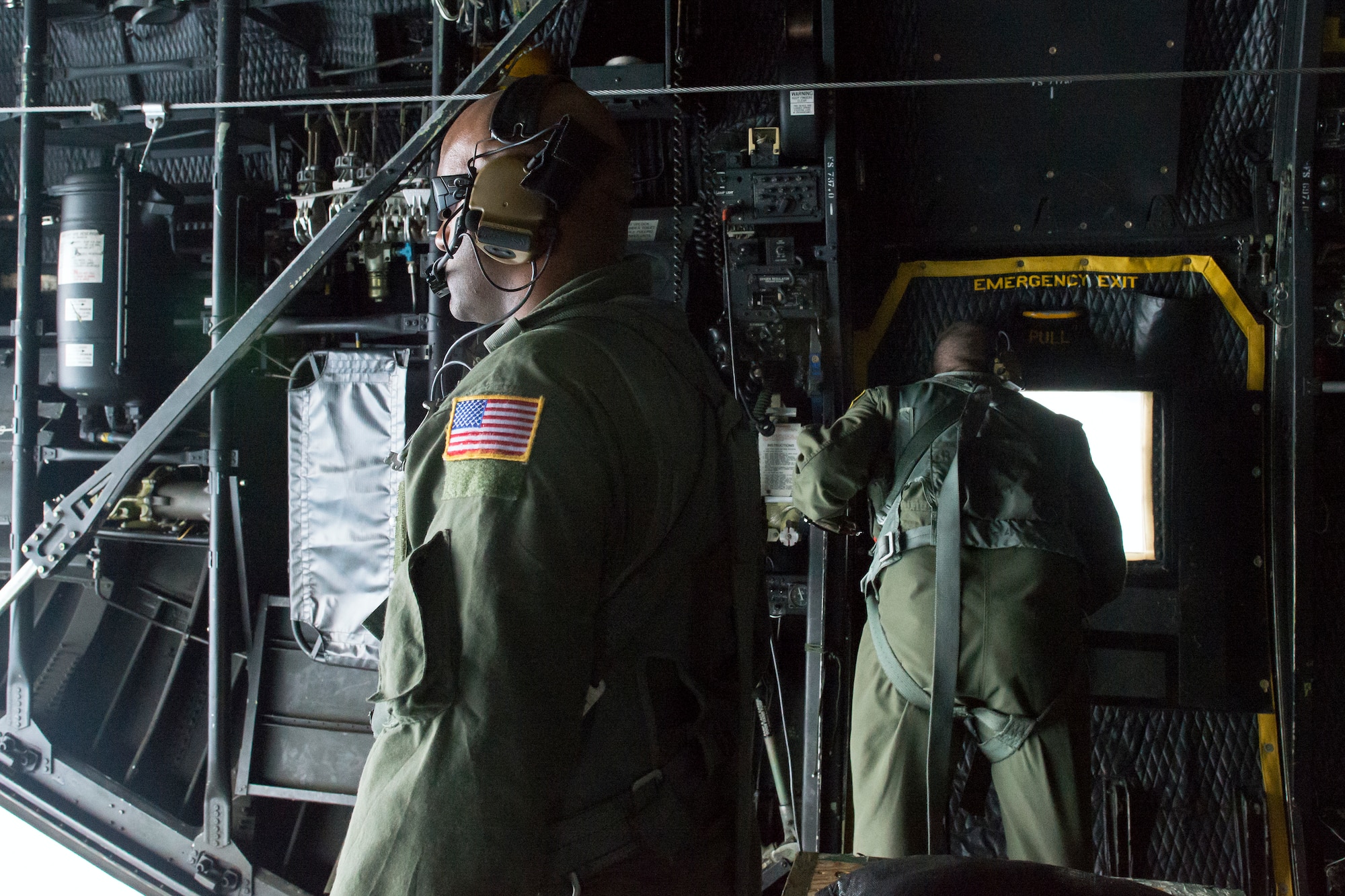 Loadmasters from the 353rd Special Operations Group observes a Japan Air Self-Defense Force UH-60J Black Hawk helicopter June 5, 2014 above the Sea of Japan during Helicopter Air-to-Air Refueling training. This is the first time that members of the 353rd SOG held HAAR training with Japan Air Self-Defense Force members on Honshu Island in Japan. (U.S. Air Force photo by Osakabe Yasuo/Released) 