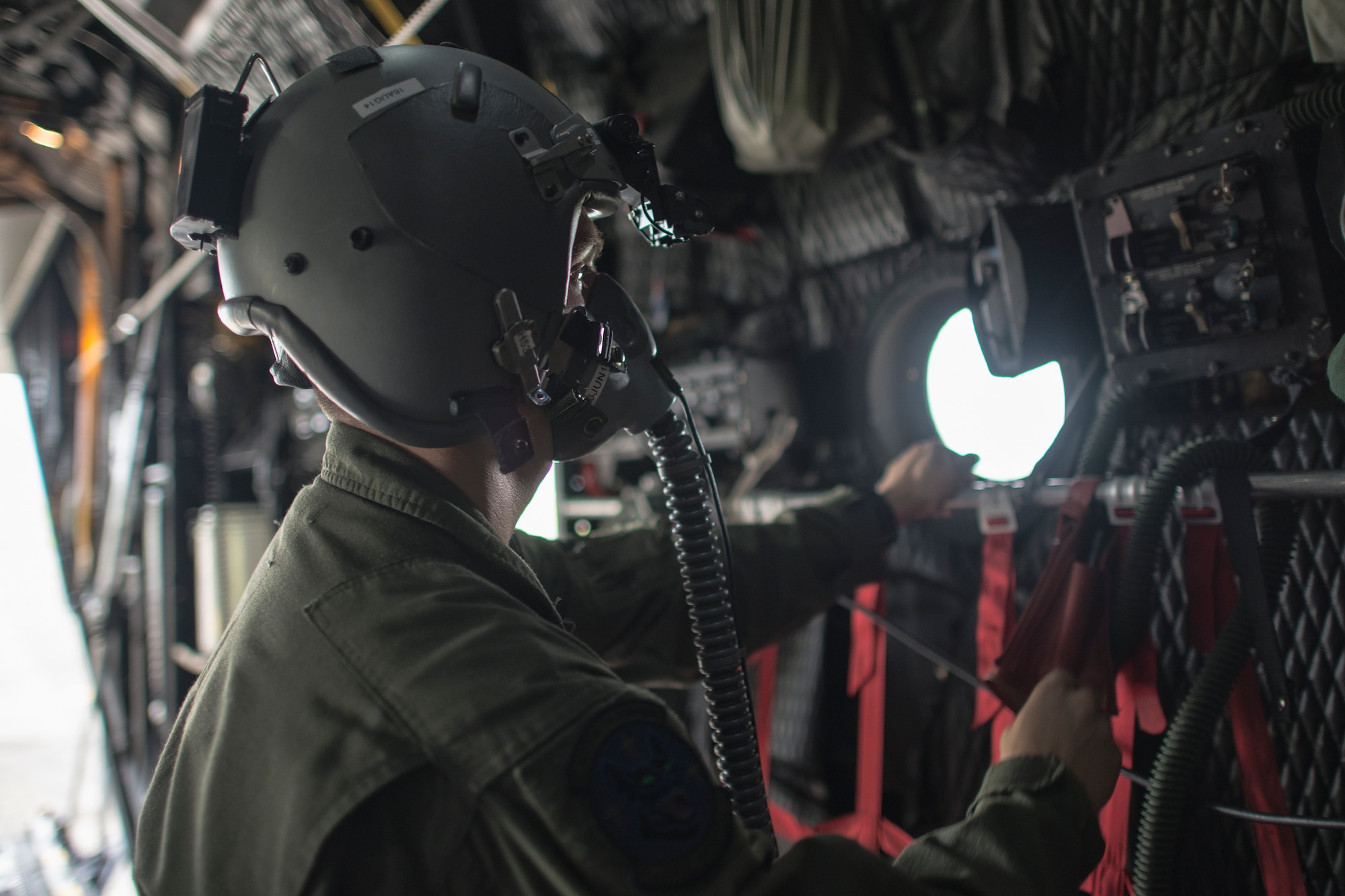 A loadmaster from the 353rd Special Operations Group performs a pre-flight check on this life support equipment at Yokota Air Base, Japan, June 5, 2014. This is the first time that members of the 353rd SOG held Helicopter Air-to-Air Refueling training with Japan Air Self-Defense Force members on Honshu Island in Japan. (U.S. Air Force photo by Osakabe Yasuo/Released) 