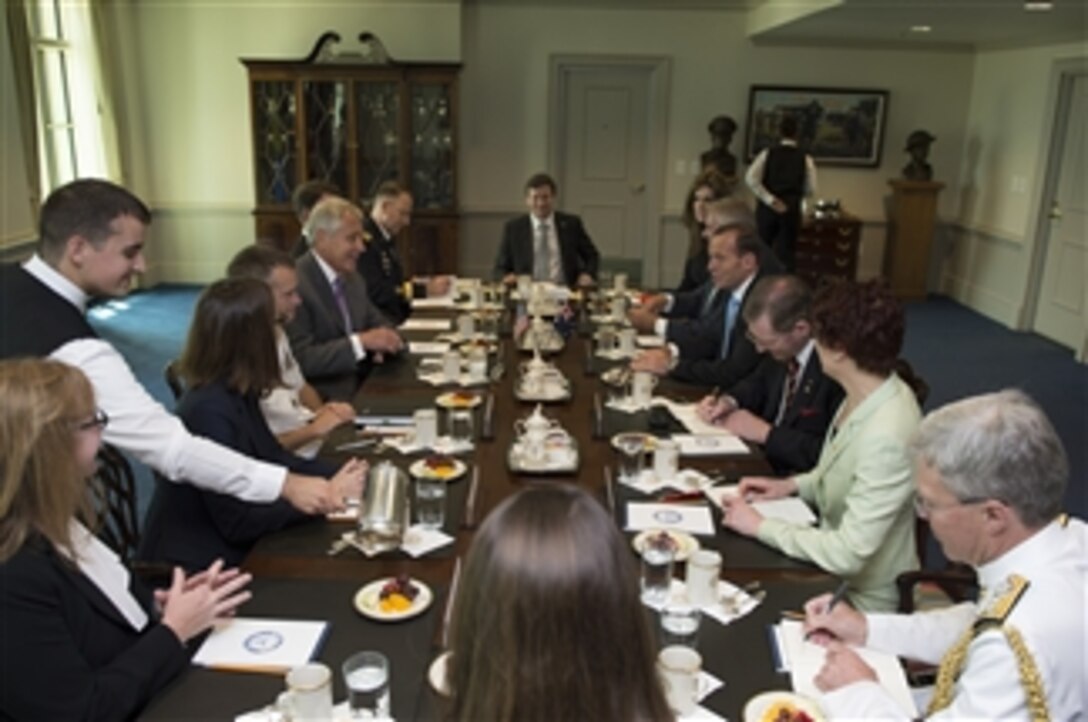 U.S. Defense Secretary Chuck Hagel, left, and Australian Prime Minister Tony Abbott meet after Hagel hosted a full-honors ceremony for him at the Pentagon, June 13, 2014. The two leaders met to discuss issues of mutual importance.