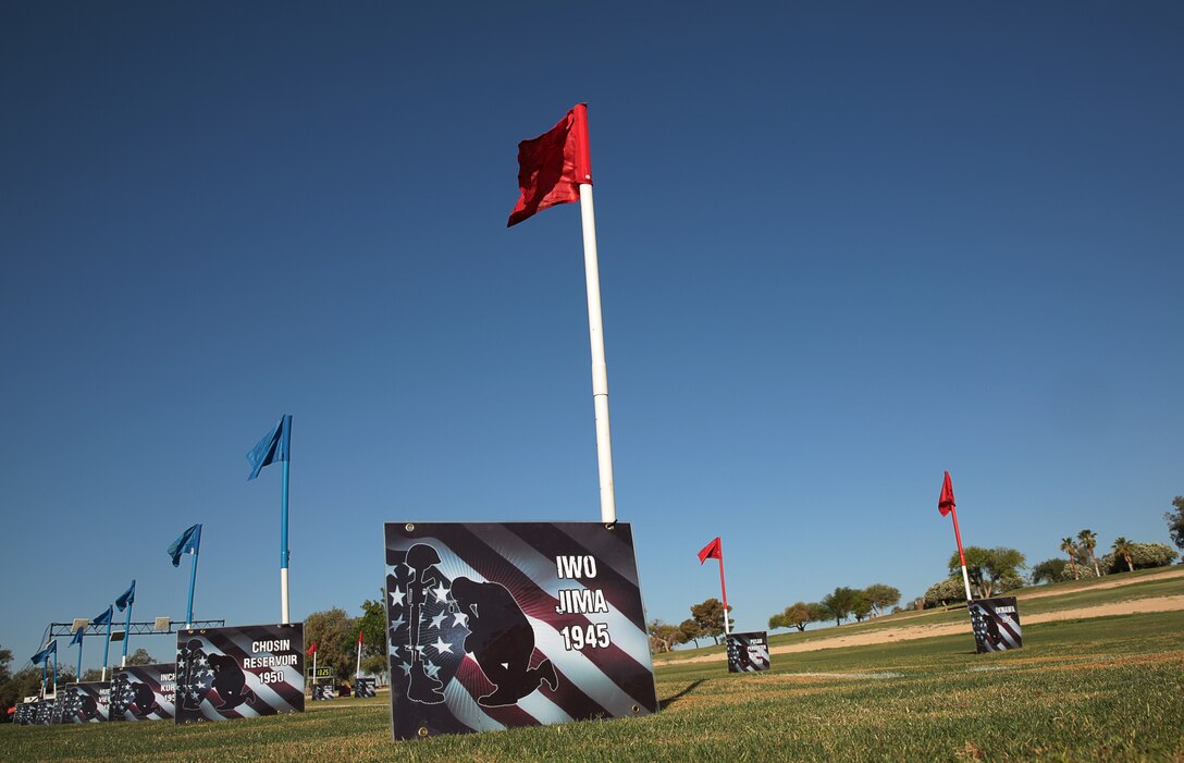 Signs depicting Marine Corps conflicts and the year which they occurred lead to the starting point of the eight-kilometer race which is part of the annual Remembrance Run hosted at Desert Winds Golf Course, May 29, 2014.



