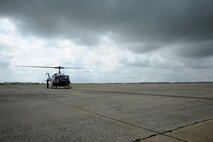 Jon Nelson preforms a preflight inspection before Air Force District of Washington Commander Maj. Gen. Sharon K. G. Dunbar takes off on her fini-flight at Joint Base Andrews, Md., June 13, 2014. Dunbar will retire from the Air Force after 32 years of service next month. Nelson works for the Dynacorp International Andrews Support Division. (U.S. Air Force photo/Master Sgt. Tammie Moore)