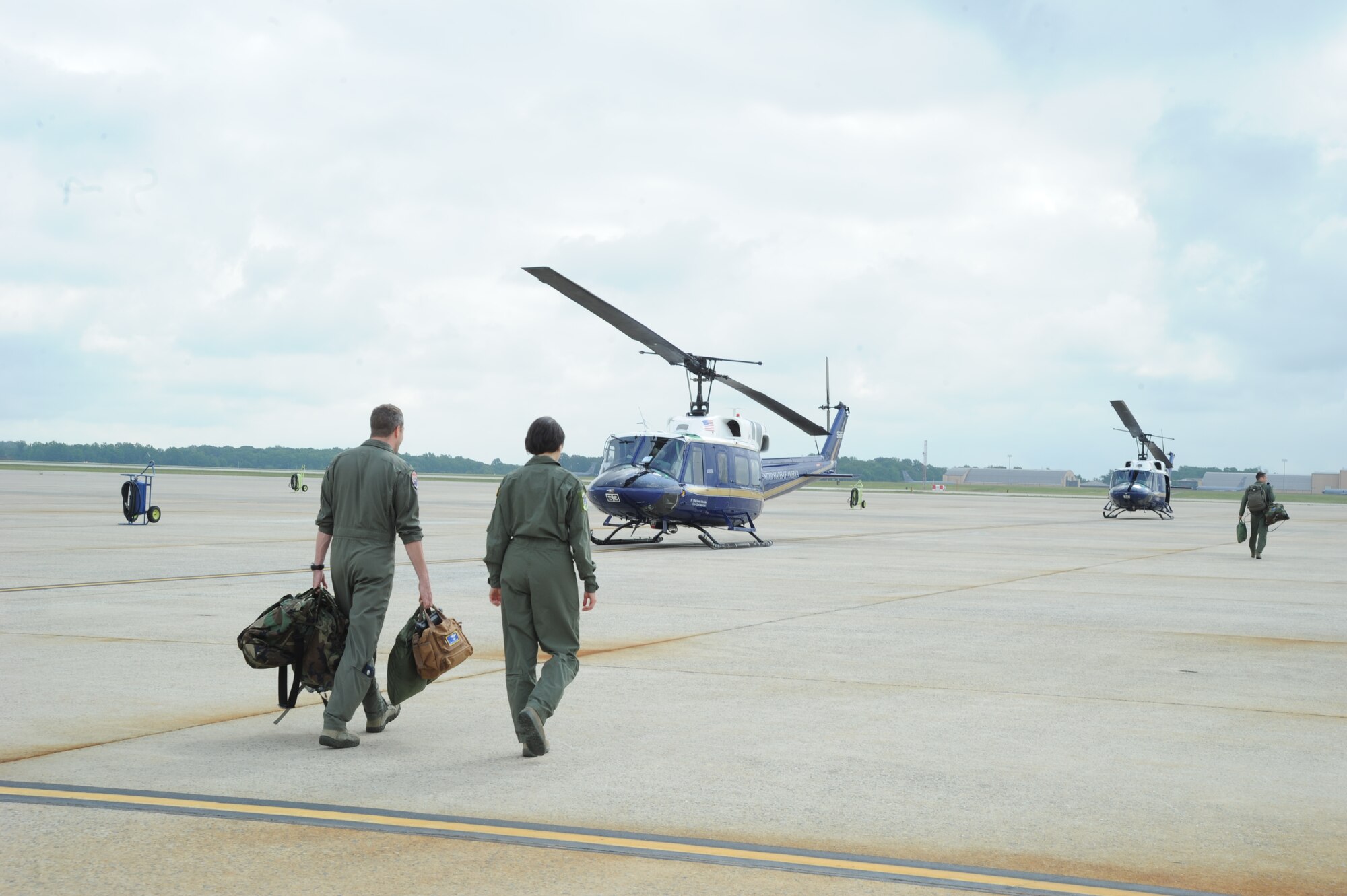 Air Force District of Washington Commander Maj. Gen. Sharon K. G. Dunbar and Lt. Col. Bill Sullivan step to a UH-1N Huey for the general’s fini-flight at Joint Base Andrews, Md., June 13, 2014. Dunbar will retire from the Air Force after 32 years of service next month. Sullivan is a 1st Helicopter Squadron pilot. (U.S. Air Force photo/Master Sgt. Tammie Moore)
