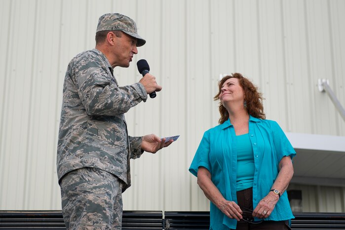 Col. John Lamontagne, 437th Airlift Wing commander, speaks to Carmen Mikolajcik-Miles, wife of the late Brig. Gen. Thomas Mikolajcik, before the Run the Runway 5K, June 14, 2014, at Joint Base Charleston, S.C. The event fostered relationships with members of the surrounding community, while raising awareness about Lou Gehrig’s disease and honoring Brig. Gen. Thomas Mikolajcik, who succumbed to the disease in 2010. (U.S. Air Force photo/Senior Airman George Goslin)