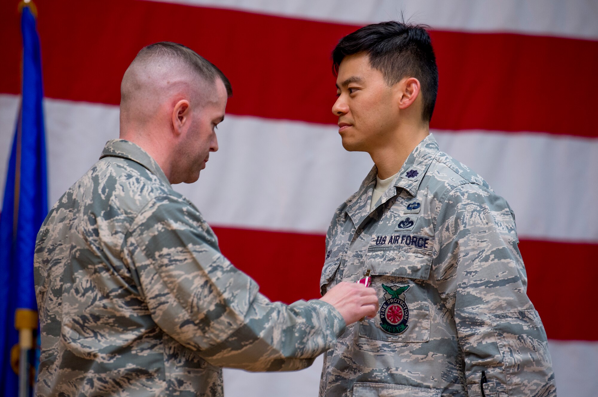 U.S. Air Force Lt. Col Chen Y. Su, 386th Expeditionary Civil Engineer Squadron commander, receives the Air Force Meritorious Service Medal during a change of command ceremony June 11, 2014 at the Rock Theater at an undisclosed location in Southwest Asia. (U.S. Air Force photo by Staff Sgt. Jeremy Bowcock)