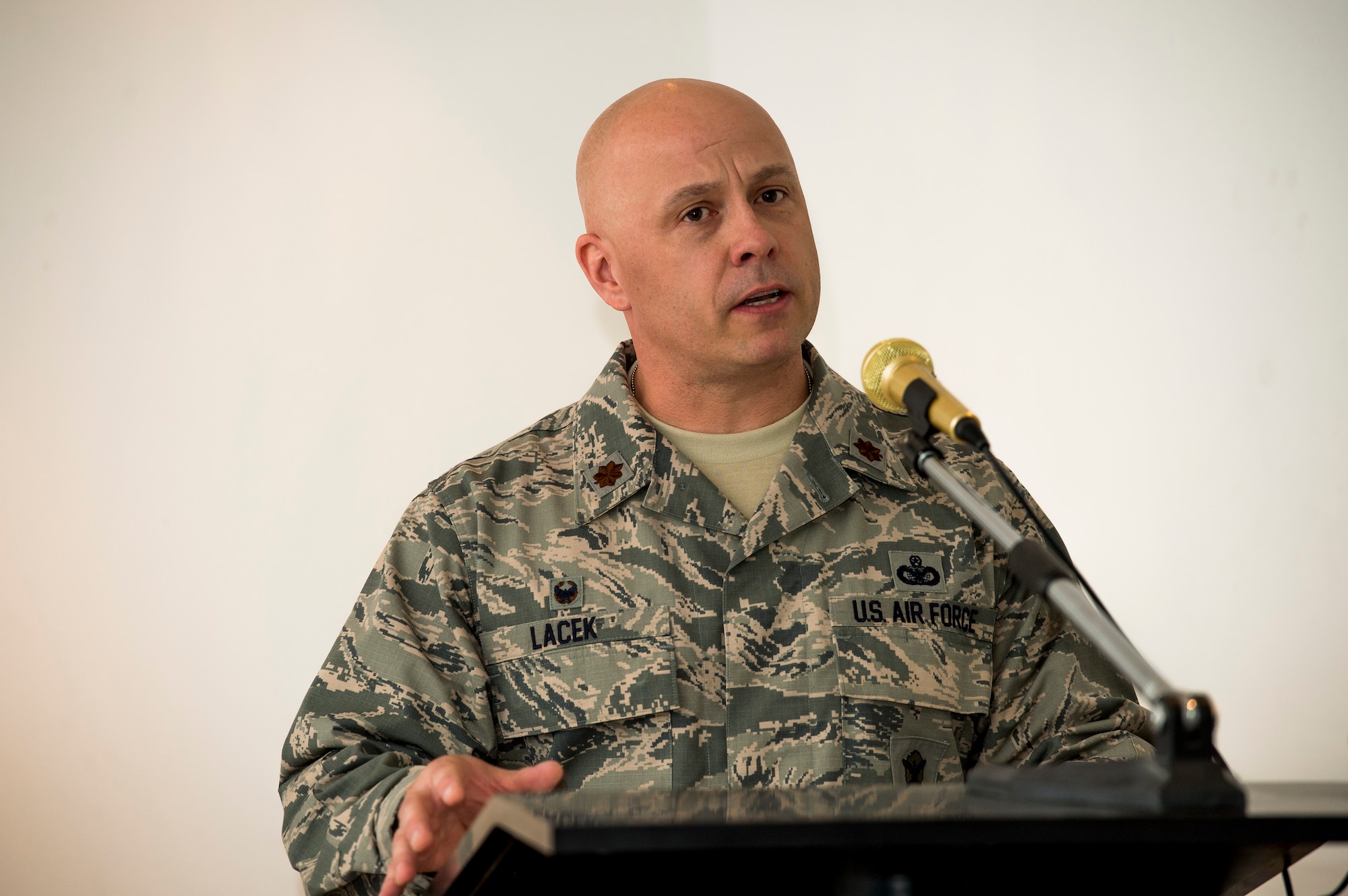 U.S. Air Force Maj. Christopher Lacek, 387th Expeditionary Security Forces Squadron commander, speaks to Airmen during a change of command ceremony June 12, 2014 at an undisclosed location in Southwest Asia. Lacek comes from McConnell Air Force Base, Kansas where he was the commander of the 22nd Security Forces Squadron. (U.S. Air Force photo by Staff Sgt. Jeremy Bowcock)