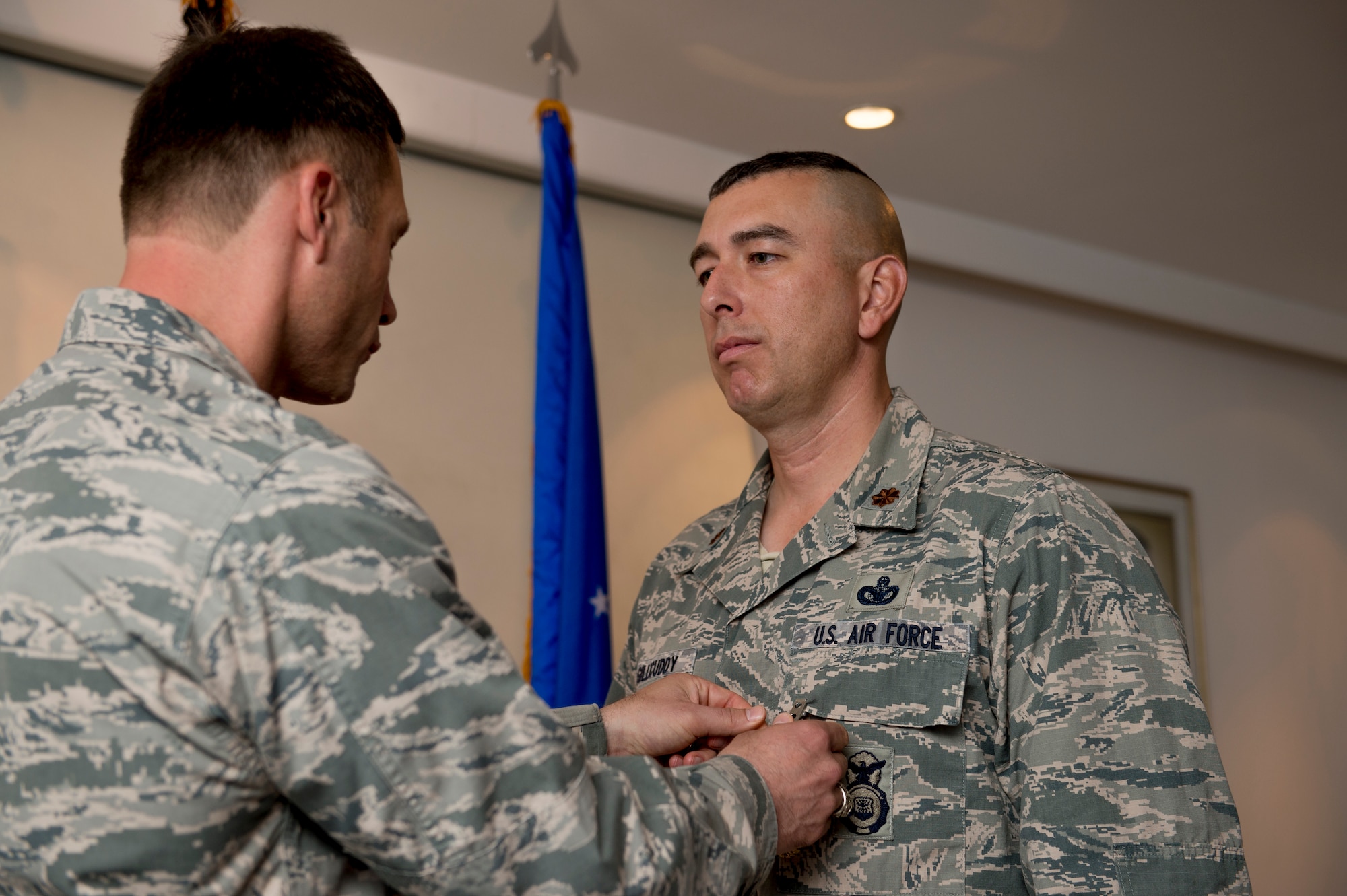 U.S. Air Force Maj. Thomas McGillicuddy, 387th Expeditionary Security Forces Squadron commander, receives the Air Force Meritorious Service Medal during a change of command ceremony June 12, 2014 at an undisclosed location in Southwest Asia. McGillicuddy will be moving on to Vance Air Force Base, Oklahoma where he will command the 71st Security Forces Squadron. (U.S. Air Force photo by Staff Sgt. Jeremy Bowcock)