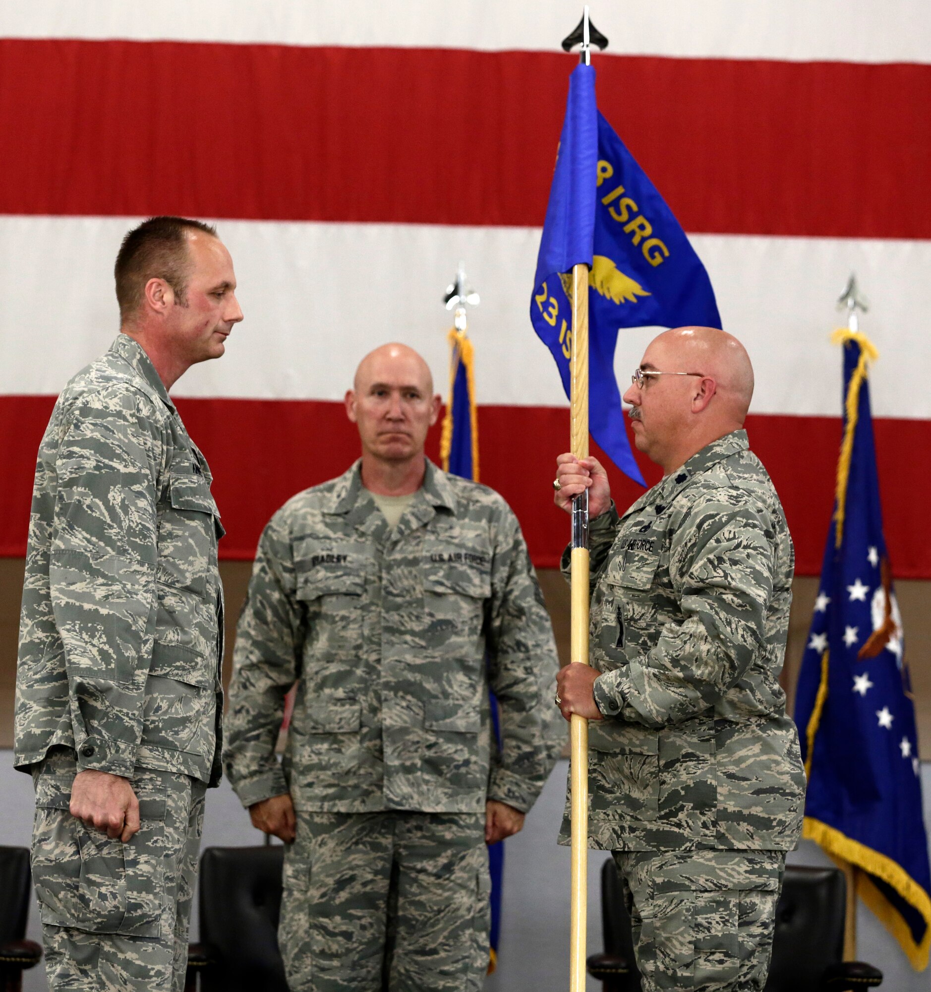 Lt. Col. John Easley, right, assumed command of the newly activated 223rd Intelligence Support Squadron during a Conversion Day ceremony held at Ebbing Air National Guard Base, Fort Smith, Arkansas, June 7, 2014. The 188th Fighter Wing was redesignated as the 188th Wing during the event. The ceremony also recognized the many changes occurring at the wing as a result of its conversion to a remotely piloted aircraft (MQ-9 Reapers) and intelligence, surveillance and reconnaissance mission. (U.S. Air National Guard photo by Master Sgt. Mark Moore)
