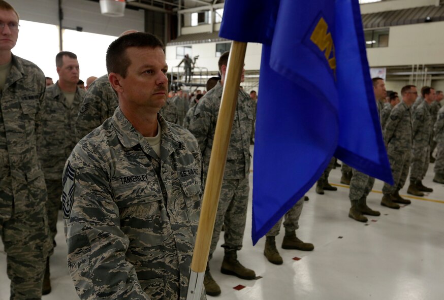 Chief Master Sgt. Dee Tankersley holds the 188th Maintenance Squadron guidon in formation at the 188th Wing’s Conversion Day ceremony June 7. The 188th Maintenance Group, 188th Maintenance Squadron, 188th Aircraft Maintenance Squadron and 188th Maintenance Operations Flight were inactivated as a result of the 188th’s conversion to a remotely piloted aircraft (MQ-9 Reapers) and intelligence, surveillance and reconnaissance mission. (U.S. Air National Guard photo by Master Sgt. Mark Moore)