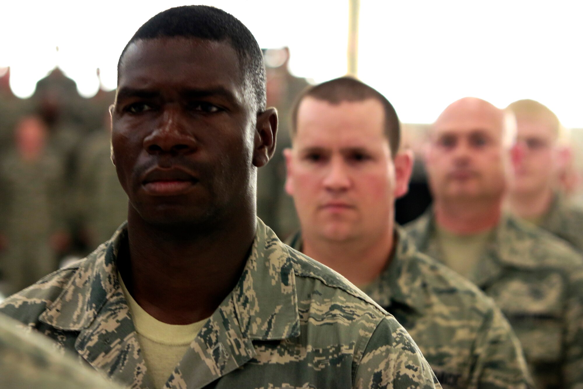 Members of the 188th Wing stand in formation at the wing’s Conversion Day ceremony, which recognized the many changes occurring at the wing as a result of its conversion to a remotely piloted aircraft (MQ-9 Reapers) and intelligence, surveillance and reconnaissance mission. The 188th Fighter Wing was also redesignated as the 188th Wing during the event. (U.S. Air National Guard photo by Staff Sgt. Matthew Pelkey)