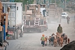 A convoy led by the Louisiana National Guard's 1086th Transportation Company, Task Force Muleskinner, makes its way through Kabul May 23, 2012. The unit was completing a 400-mile convoy from Bagram Air Field to Forward Operating Base Warrior and back as security for more than a dozen Afghan-owned cargo trucks, taking one of Afghanistan's most dangerous roads - Highway 1.