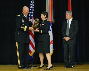 Army Capt. Audrey L. Fielding, Ohio Army National Guard, accepts her award at the 2011 General Douglas MacArthur Leadership Award ceremony May 24, 2012 at the Pentagon Auditorium in Arlington, Va. Army Chief of Staff Gen. Ray Odierno presented the award to 22 other recipients - six of which were National Guard members - from all three Army components.