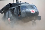 Soldiers from C Company, 1st Battalion, 171st Aviation Regiment, land in a UH-60 Black Hawk helicopter during a training flight on Camp Dwyer, Afghanistan. Soldiers from the unit recently transported a critically wounded Marine who had live rocket propelled grenade round embedded in his leg. Without the quick thinking of the air crew, the Marine would not have survived.