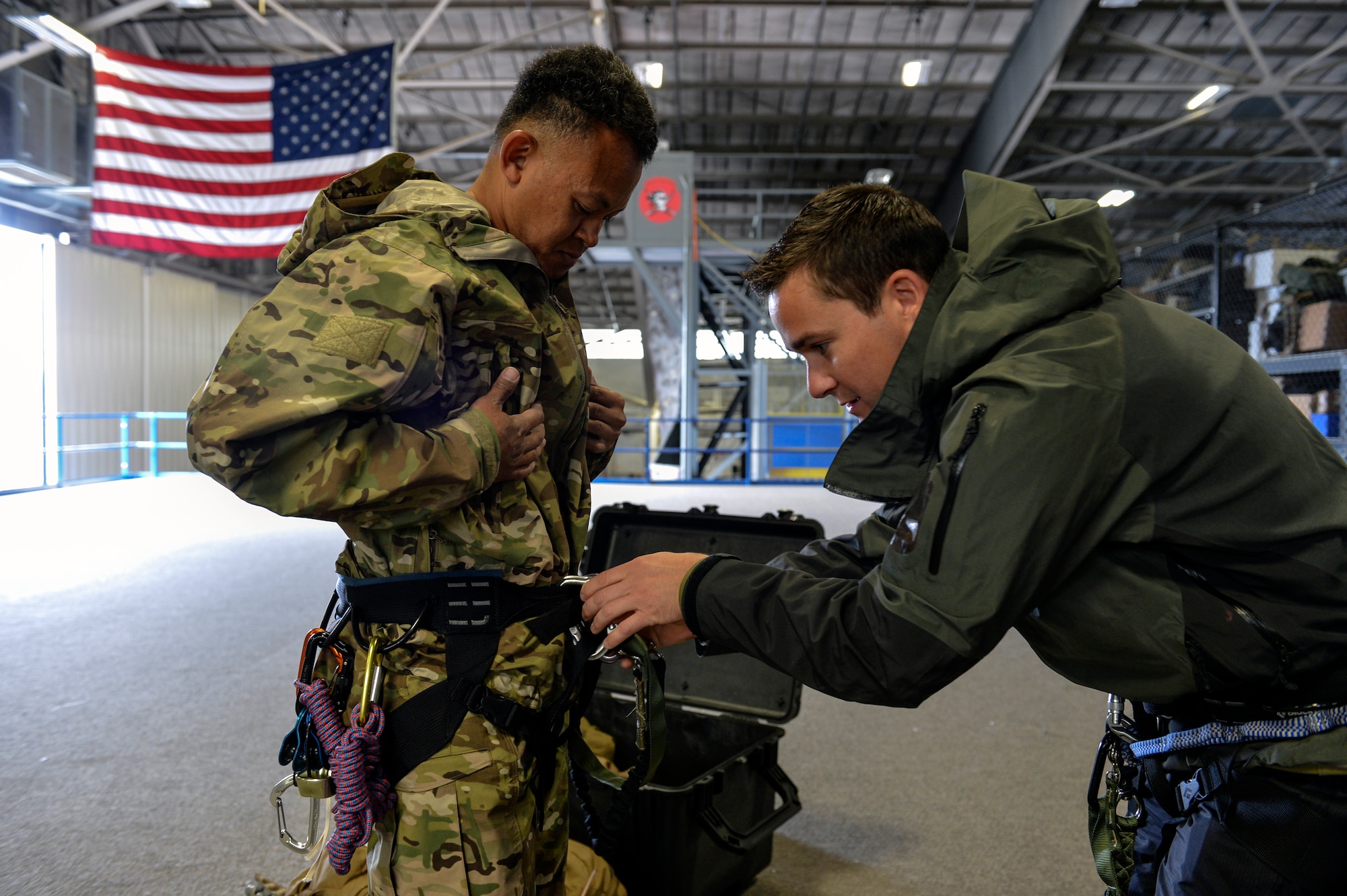 2nd Lt. Ryan McQuillan (right), 22nd Special Tactics Squadron officer in charge weapons and tactics, performs a buddy check for the climbing equipment of Master Sgt. Kim Brewer (left), 22nd STS NCO in charge of weapons and tactics June 4, 2014, at Joint Base Lewis-McChord, Wash. Due to their hoist operations and climbing experience, McQuillan and Brewer were called to evacuate a patient from Disappointment Cleaver on Mount Rainier. (U.S. Air Force photo/Staff Sgt. Russ Jackson)