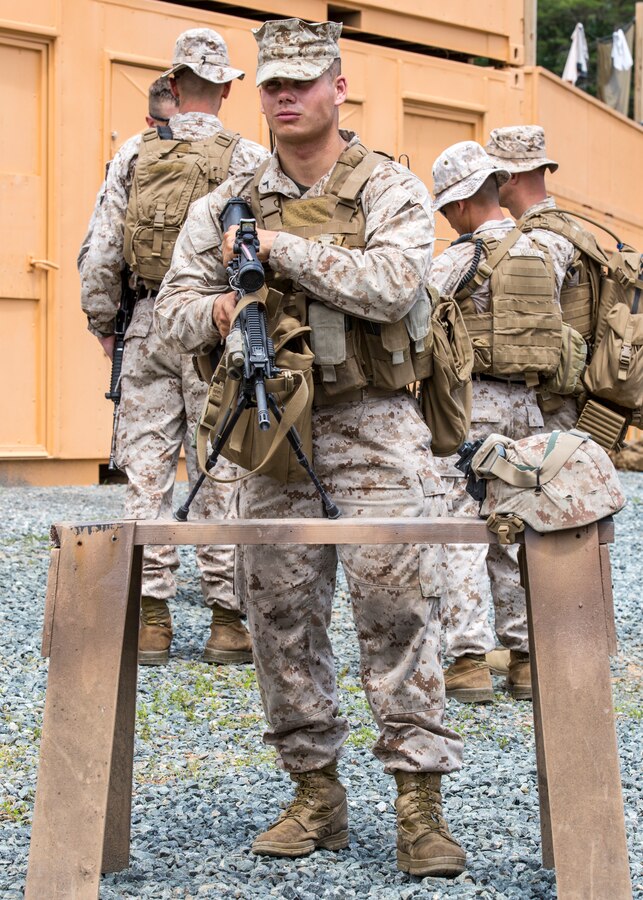 U.S. Marine Corps Pfc. Jacob Howarth, a rifleman assigned to Fox Company, 2nd Battalion, 2nd Marine Regiment (2/2) conducts gate security during an embassy reinforcment exercise aboard Quantico, Va., June 11.  The 26th Marine Expeditionary Unit, 2/2 and VMM-264 conducted embassy reinforcement training  June 10-13, 2014. Marines conducted the training to prepare for possible real world scenarios. (U.S. Marine Corps photo by Lance Cpl. Joshua W. Brown/Released)