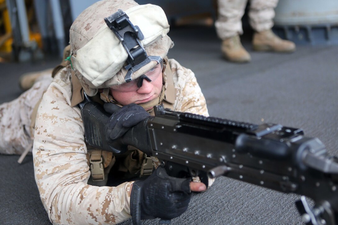 Lance Cpl. Jacob Adams, a machine gunner with Echo Company, Battalion Landing Team 2nd Battalion, 1st Marines, 11th Marine Expeditionary Unit, and an Ozark, Missouri native, scans the area during a small craft action team (SCAT) drill during Certification Exercise (CERTEX) off the coast of Southern California, June 14. CERTEX is comprised of a specific series of missions intended to evaluate and certify the 11th MEU for their upcoming deployment with the Makin Island Amphibious Ready Group scheduled for later this summer. (U.S. Marine Corps photo by Sgt. Melissa Wenger/Released)