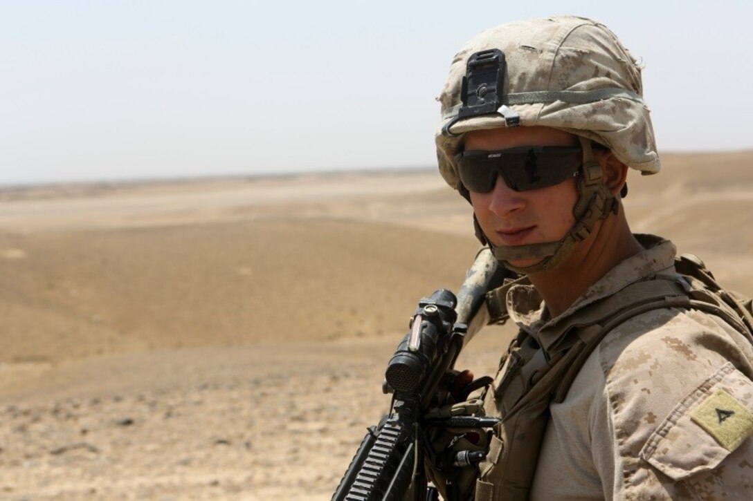Lance Corporal Justin Countryman, a Tallahassee, Florida, native and rifleman with 1st Battalion, 2nd Marine Division, provides security during a patrol in Helmand province, Afghanistan, June 3, 2014. Security patrols are designed to secure the safety of coalition forces aboard the Bastion-Leatherneck complex. (U.S. Marine Corps photo by Cpl. Michael Dye/ Released)