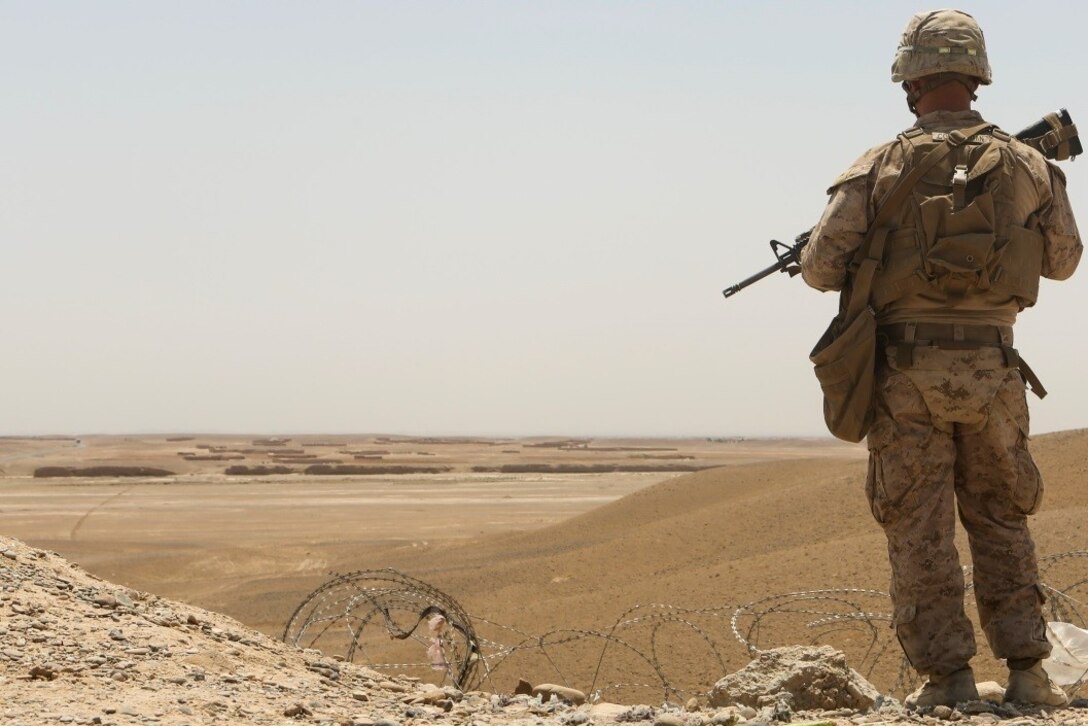 Lance Corporal Justin Countryman, a Tallahassee, Florida, native and rifleman with 1st Battalion, 2nd Marine Division, provides security during a patrol in Helmand Province, Afghanistan, June 3, 2014. Security patrols are designed to secure the safety of coalition forces aboard the Bastion-Leatherneck complex. (U.S. Marine Corps photo by Cpl. Michael Dye/ Released)