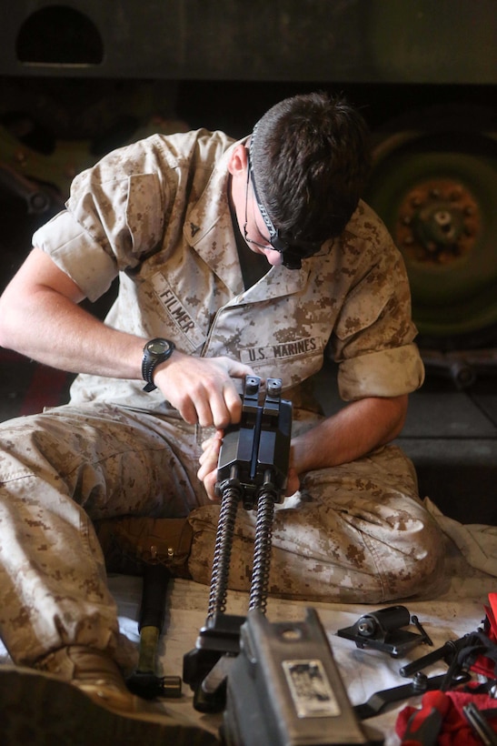 Lance Cpl. Alan Filmer, an armorer with Combat Logistics Battalion 11, 11th Marine Expeditionary Unit, and a Portland native, performs maintenance on a Mk 19 automatic grenade launcher during Certification Exercise (CERTEX) off the coast of Southern California June 12. CERTEX serves as the final at-sea period for the 11th MEU and Amphibious Squadron 5. It is designed to strengthen the blue-green team's ability to operate together, and to respond to various situations while deployed. 