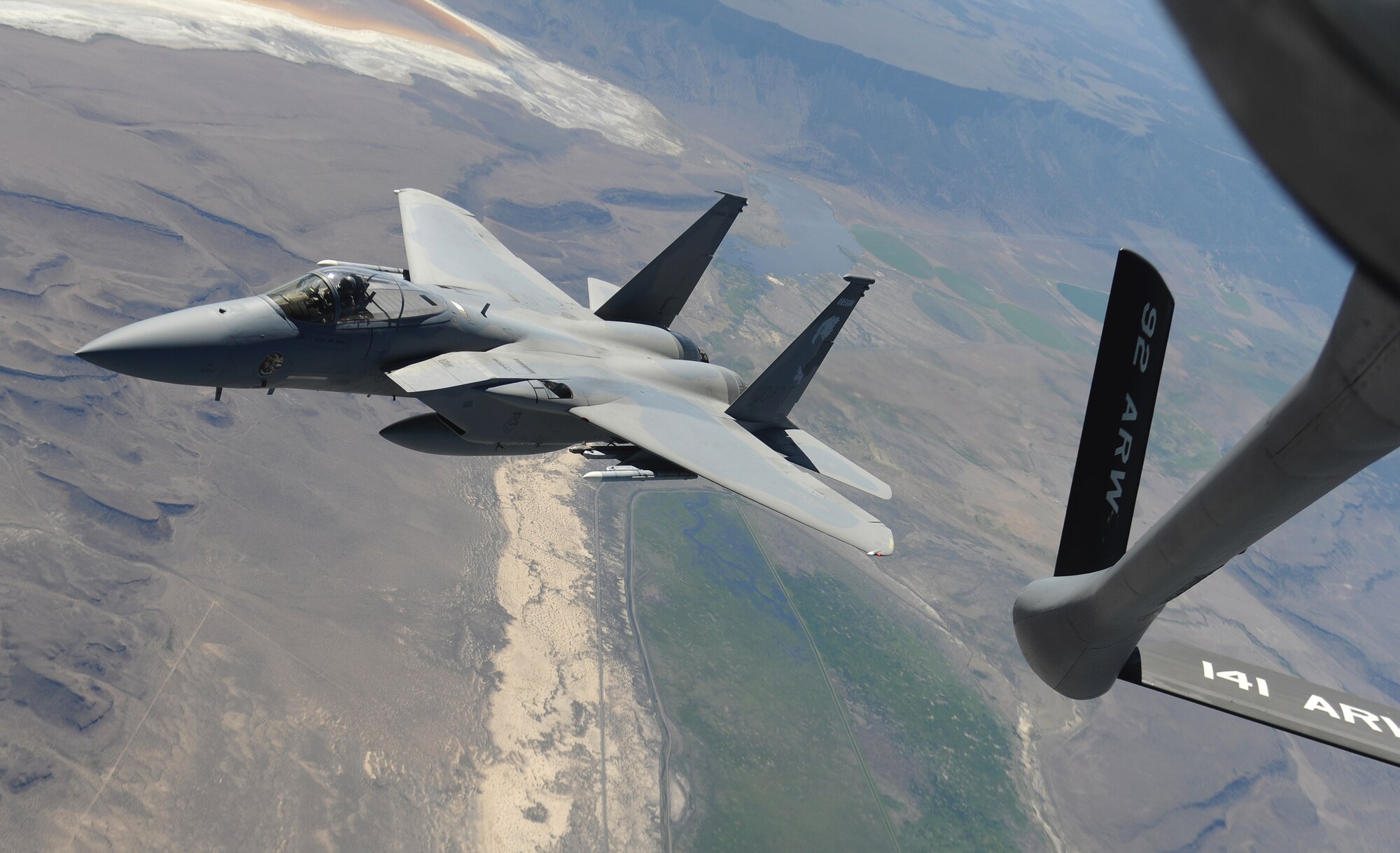 An F-15C Eagle from Fresno, Calif., departs from a KC-135 Stratotanker’s boom during a training mission over California June 11, 2014. During the flight, the crew performed training procedures with five F-15s from Kingsley Field, Ore. (U.S. Air Force photo by Airman 1st Class Janelle Patiño/Released)