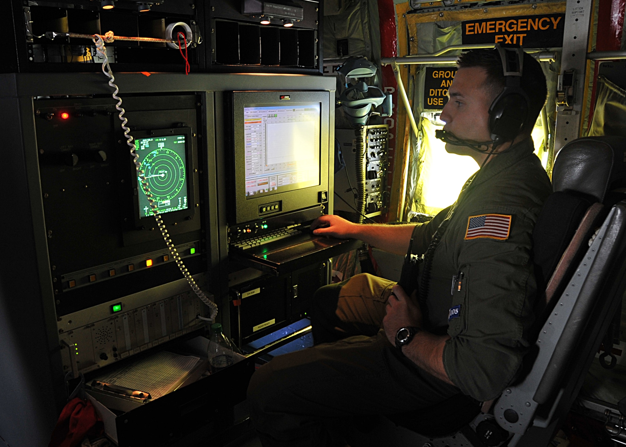 Senior Airman Nathan Calloway, 53rd Weather Reconnaissance Squadron loadmaster, takes part in training June 13. The 53rd WRS, from Keesler Air Force Base, Mississippi, teamed up with the 446th AES, McChord Field, Washington, teamed up for inflight medical training June 13-15, 2014. (U.S. Air Force photo/Maj. Marnee A.C. Losurdo) 