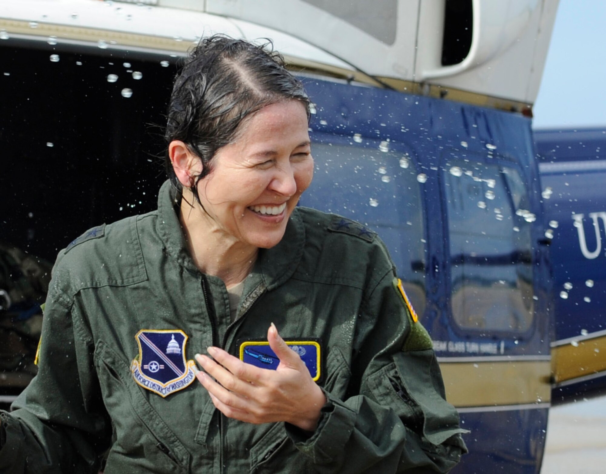 Maj. Gen. Sharon K. G. Dunbar is sprayed with water after her fini-flight at Joint Base Andrews, Md., June 13, 2014. Dunbar, Air Force District of Washington and 320th Air Expeditionary Wing commander, will be retiring after 32 years of service.  Family, friends and coworkers gather to celebrate Dunbar’s final flight. (U.S. Air Force photo/ Senior Airman Nesha Humes)