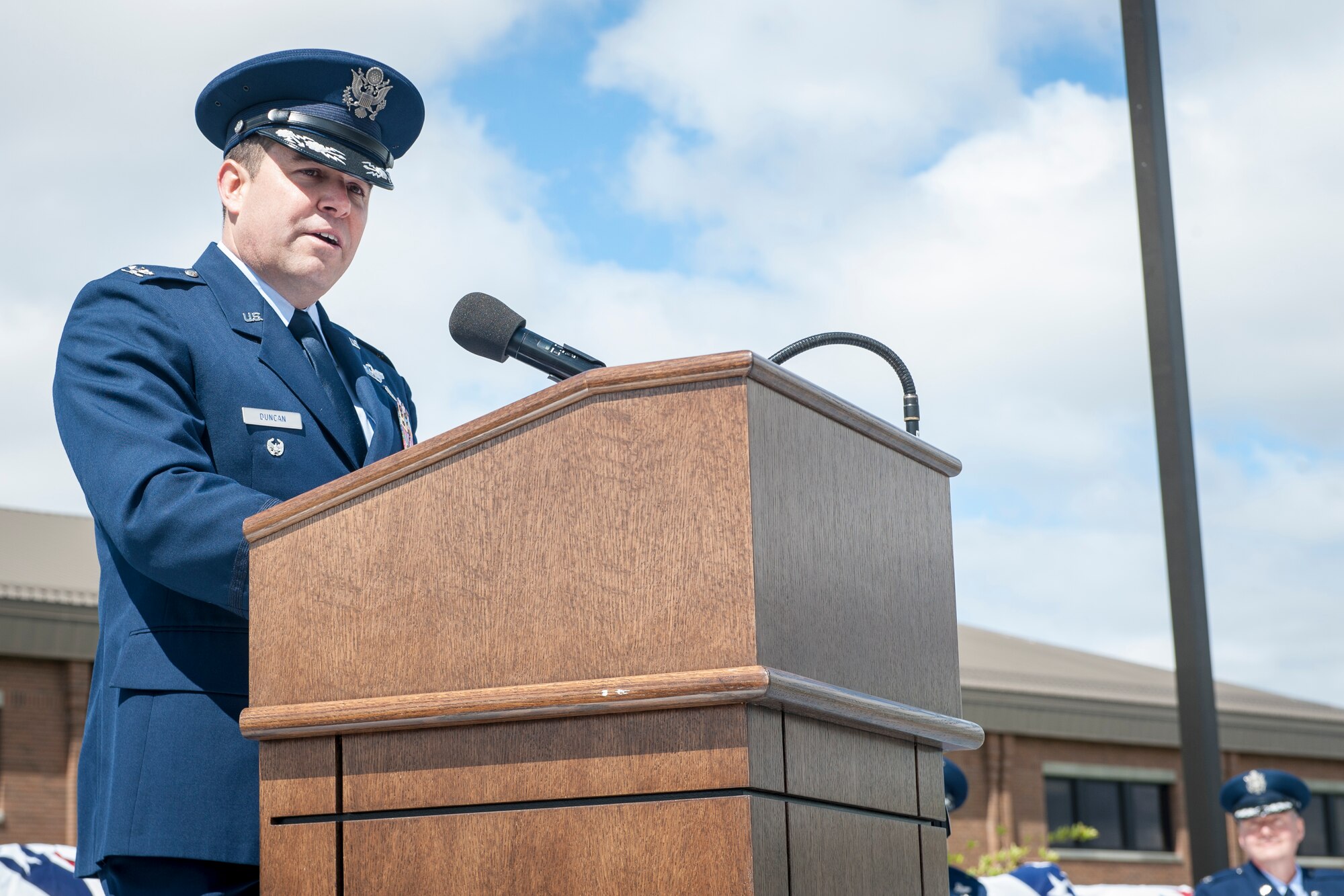 Col. Jonathan Duncan thanks all in attendance at the 336th Training Group’s change of command ceremony for attending, for the outgoing commander’s service and described how the group will continue to prosper at Fairchild Air Force Base, Wash., June 16, 2014. Duncan comes to Fairchild from an assignment at Hurlburt Field, Fla., where he served as the Chief, Programs Division, Headquarters Air Force Special Operations. The 336th TRG is the sole manager of all U.S. Air Force Survival, Evasion, Resistance and Escape training. Its mission is to provide at risk of isolation personnel with the skills and confidence to “Return with Honor.” (U.S. Air Force photo by Staff Sgt. Benjamin W. Stratton/Released)