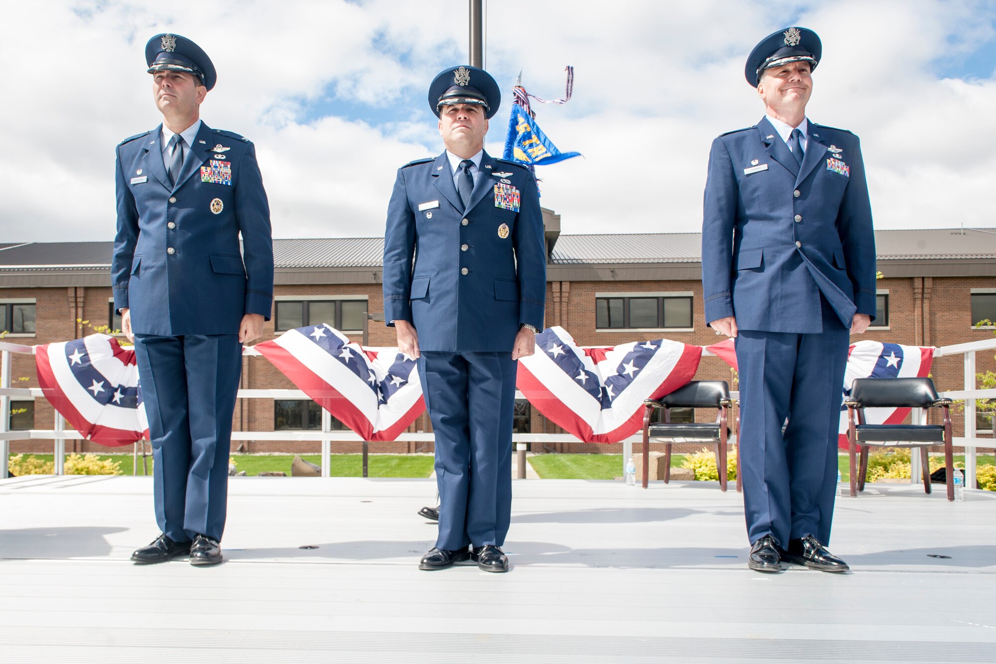 Cols. Vincent Becklund, Jonathan Duncan and William “Bill” Thomas stand at attention following the 336th Training Group’s change of command during the ceremony at Fairchild Air Force Base, Wash., June 16, 2014. Becklund is the 58th Special Operations Wing commander and administrative home to the 336th TRG at Kirtland Air Force Base, N.M. Thomas, who retires after 24 years in August, served as the 336th TRG commander for more than two years earning dozens of accolades in his short tenure. Duncan comes to Fairchild from an assignment at Hurlburt Field, Fla., where he served as the Chief, Programs Division, Headquarters Air Force Special Operations. The 336th TRG is the sole manager of all U.S. Air Force Survival, Evasion, Resistance and Escape training. Its mission is to provide at risk of isolation personnel with the skills and confidence to “Return with Honor.” (U.S. Air Force photo by Staff Sgt. Benjamin W. Stratton/Released)