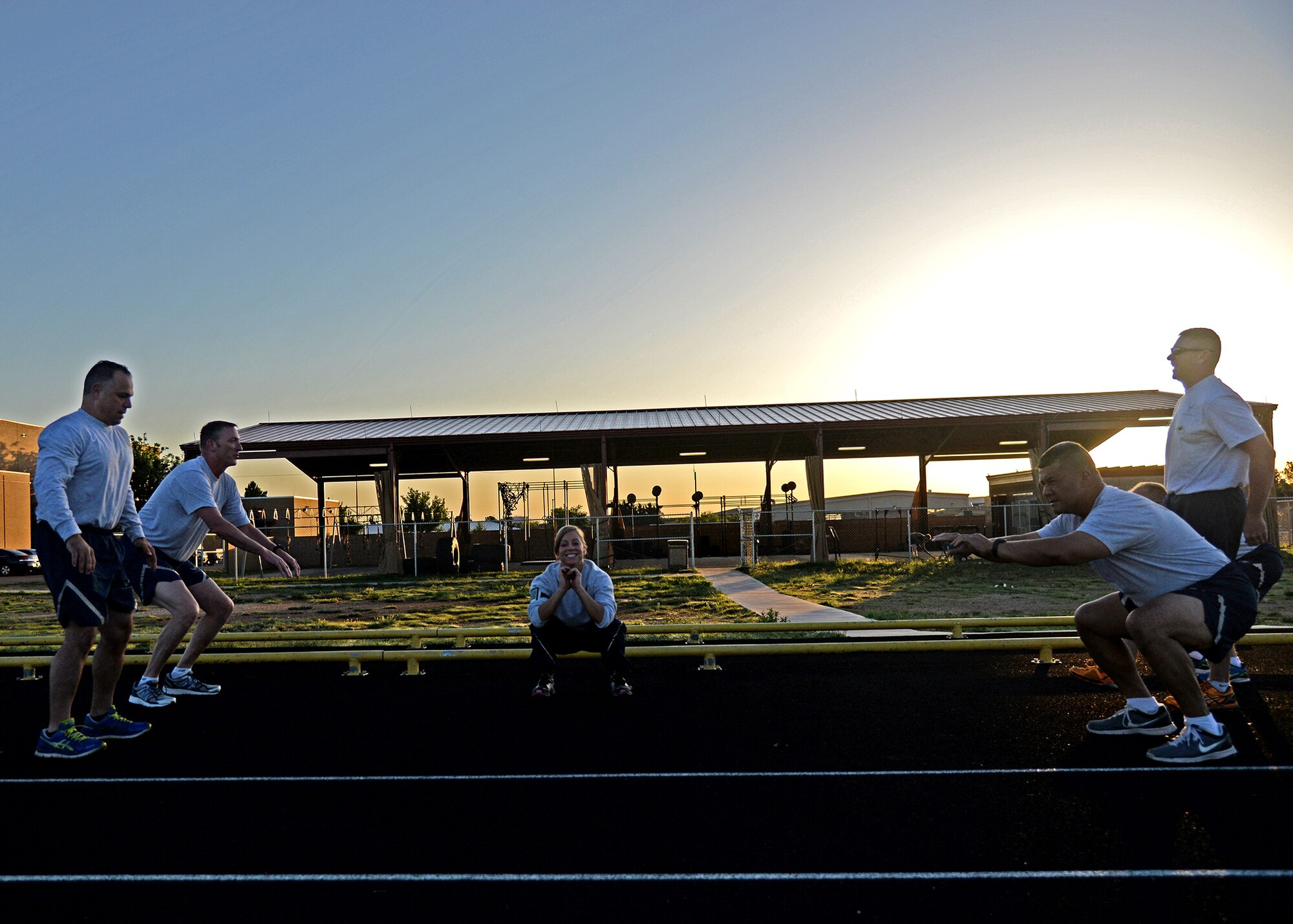 U.S. Air Force Senior Airman Erin Pickering, 522nd Special Operations Squadron, planned and implemented a workout for Chief Master Sgt. Matthew Caruso, Air Force Special Operations Command chief during his visit to Cannon Air Force Base, N.M. on June 10, 2014. Pickering is currently in Airman Leadership School. (U.S. Air Force photo/Airman 1st Class Chip Slack)