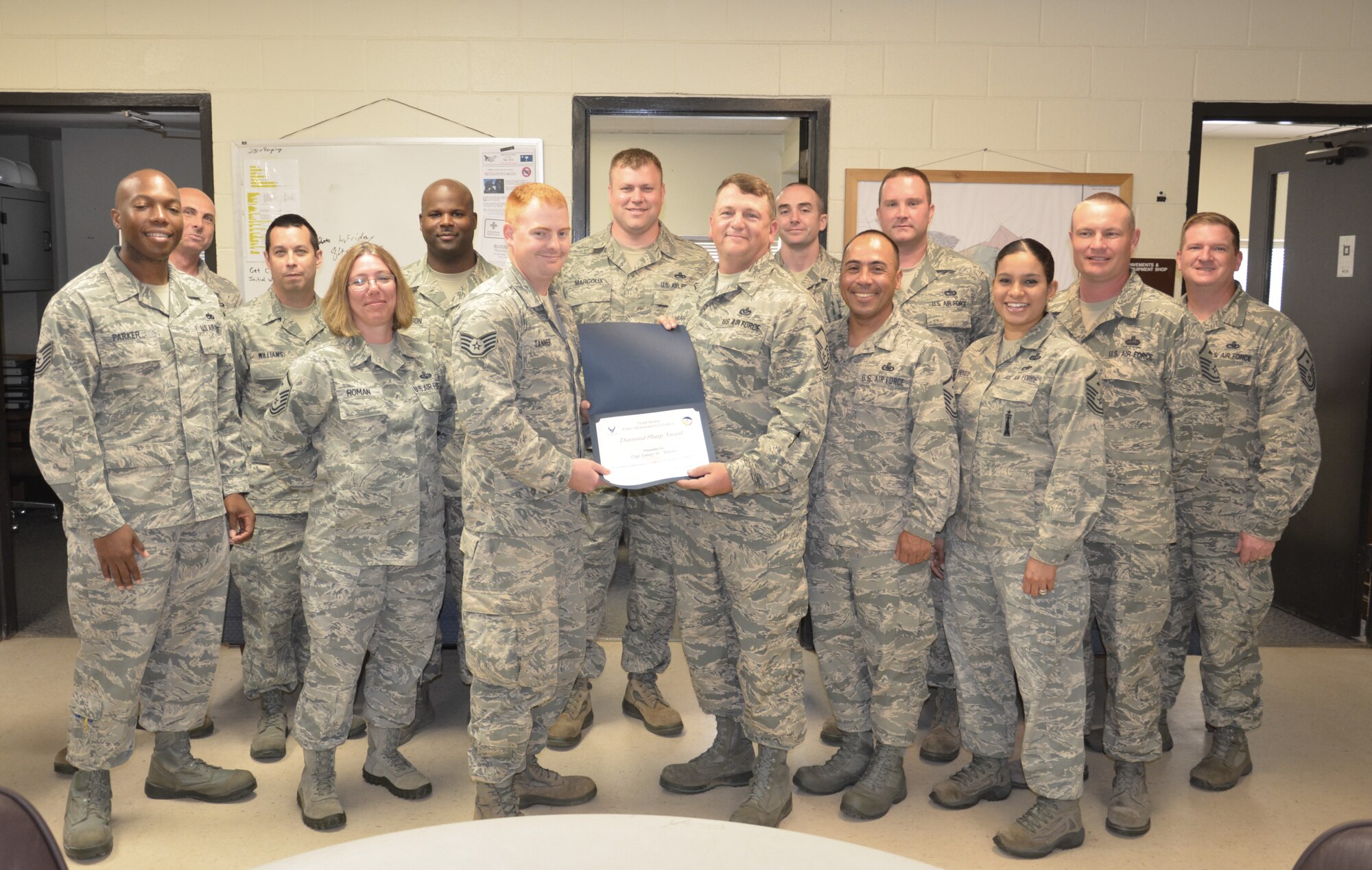 U.S. Air Force Staff Sgt. Sonny Tanner, 20th Civil Engineer Squadron pavement and construction equipment craftsmen, is recognized by members of the Shaw First Sergeants Council as "Diamond Sharp." Diamond Sharp, the First Sergeant Council’s newly adopted program, aims to recognize two Airmen from across Shaw Air Force base monthly. (Courtesy photo)