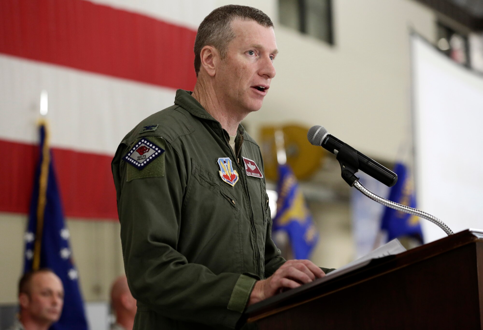 Col. Mark Anderson, 188th Wing commander, speaks to a packed hangar during a Conversion Day ceremony held at Ebbing Air National Guard Base, Fort Smith, Arkansas, June 7, 2014. The ceremony recognized the many changes occurring at the wing as a result of its conversion to a remotely piloted aircraft (MQ-9 Reapers) and intelligence, surveillance and reconnaissance mission. The 188th Fighter Wing was redesignated as the 188th Wing during the event. (U.S. Air National Guard photo by Master Sgt. Mark Moore)