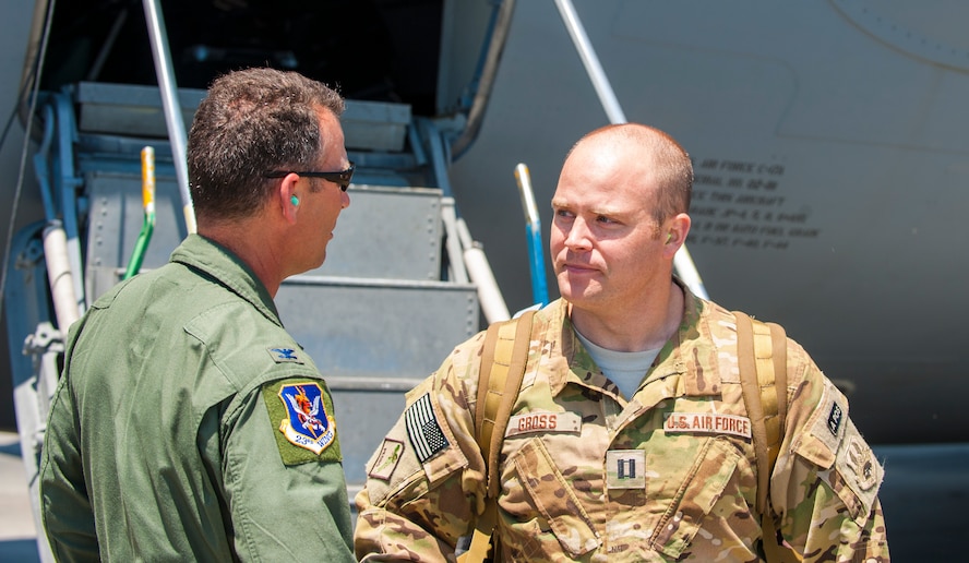 U.S. Air Force Col. Chad Franks, 23d Wing commander, greets, Capt. Adam Gross, 41st Rescue Squadron flight commander, at Moody Air Force Base, Ga., June 10, 2014. Gross and his fellow Airmen returned from a four-month deployment to Bagram Airfield, Afghanistan. (U.S. Air Force photo by Airman 1st Class Ceaira Tinsley/Released)